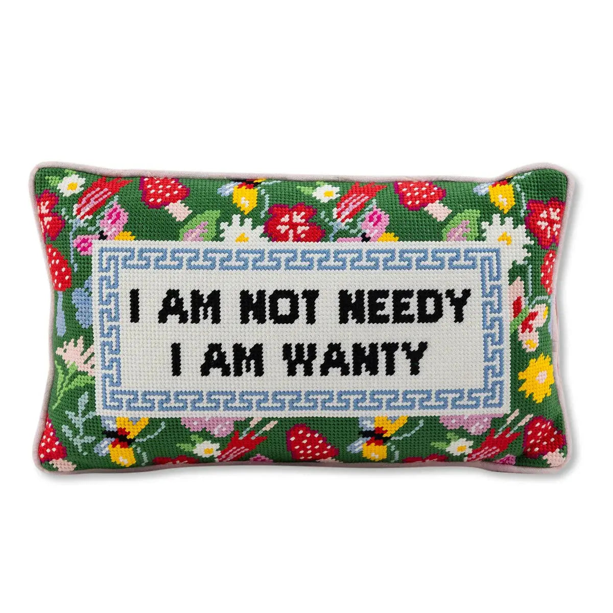 Decorative pillow with floral patterns and text on it that says I am Not Needy I am Wanty on a white background