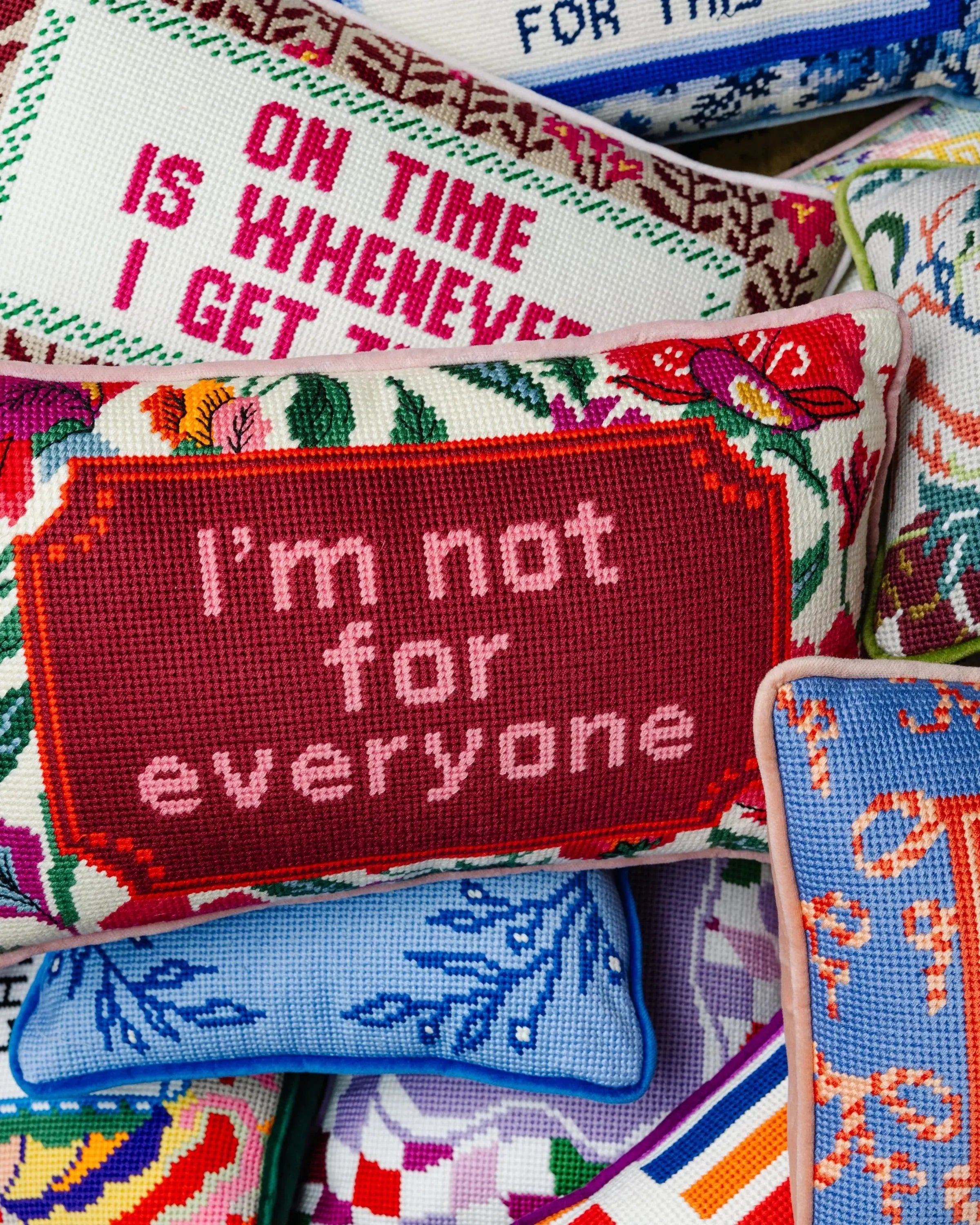 Colorful cross-stitch pillows with funny quotes, farmhouse decor, cozy cottage style accent cushions