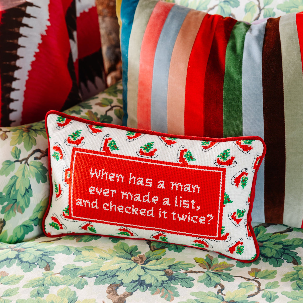 Decorative pillow with text on a colorful sofa