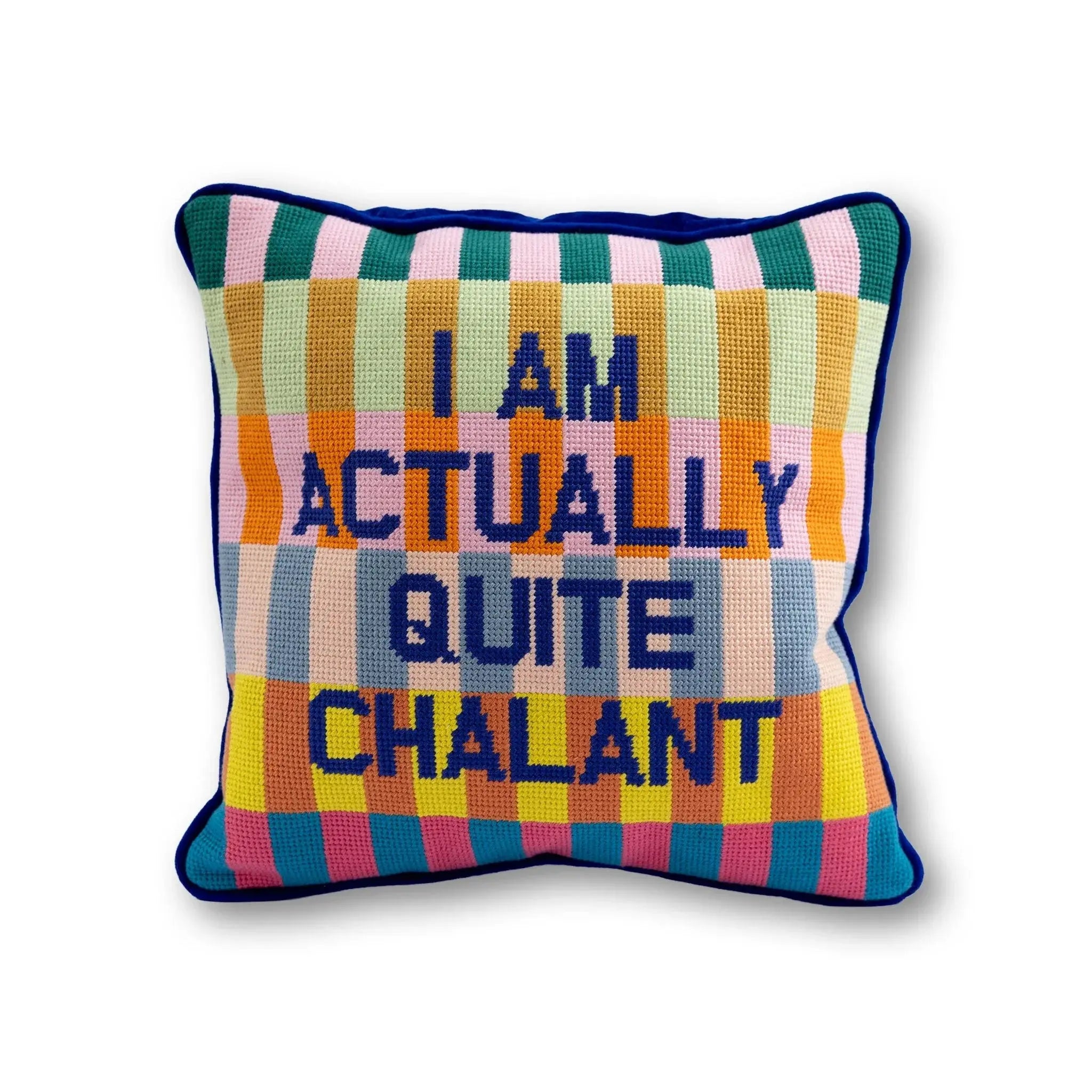 Colorful crochet pillow with 'I AM ACTUALLY QUITE CHALANT' text, cozy farmhouse decor accent