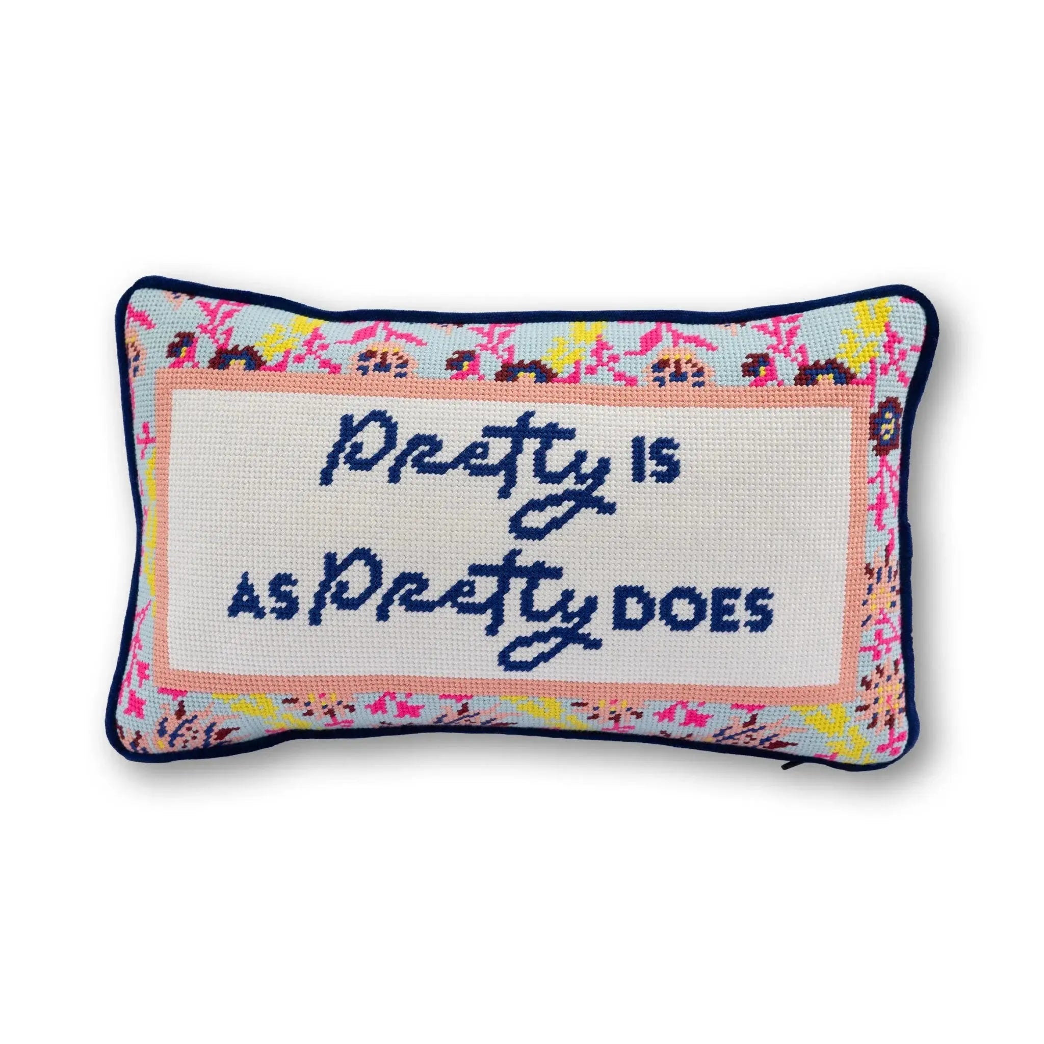 Decorative pillow with text "Pretty is as Pretty Does" on  a white background