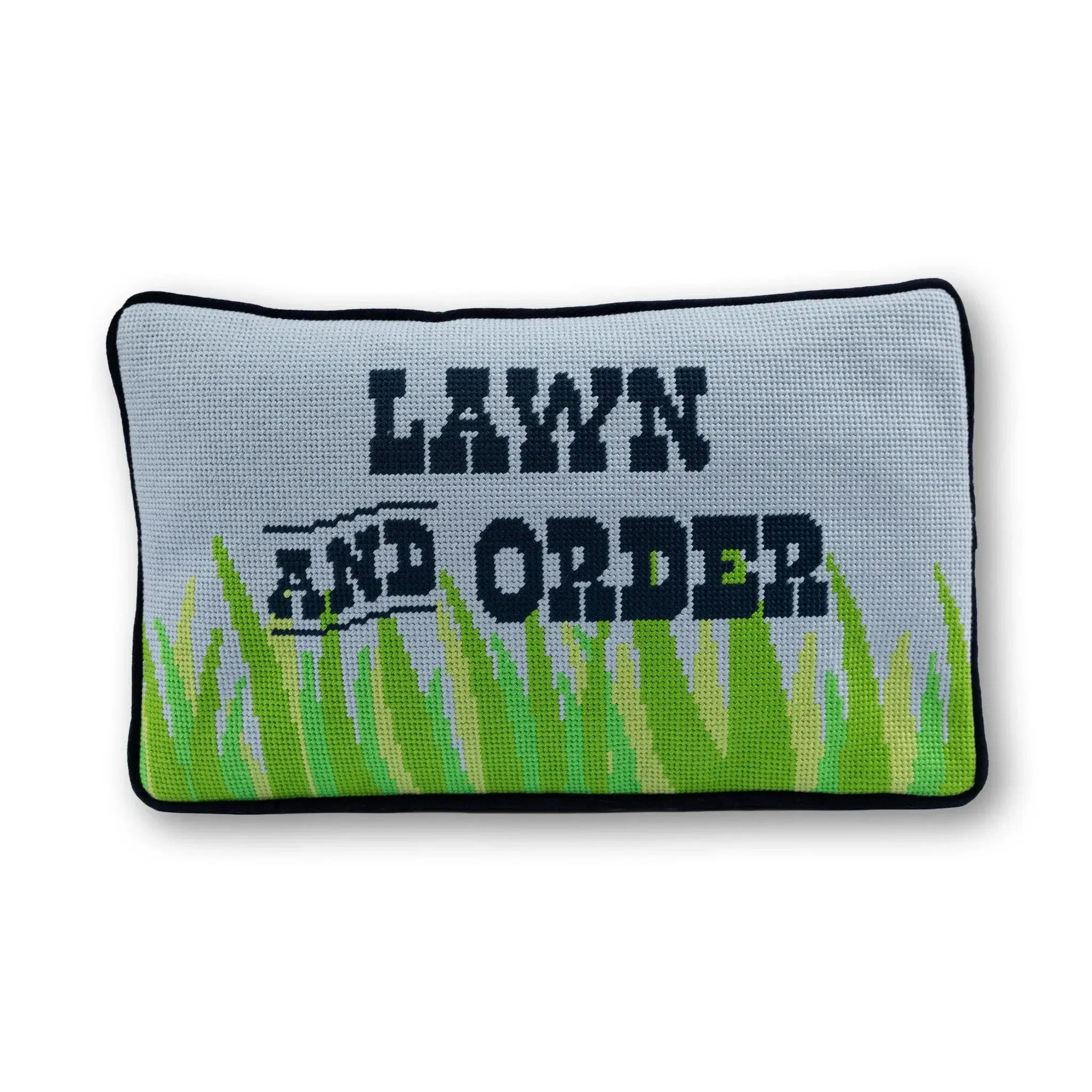 Decorative pillow with 'Lawn and Order' text and grass pattern on a white background