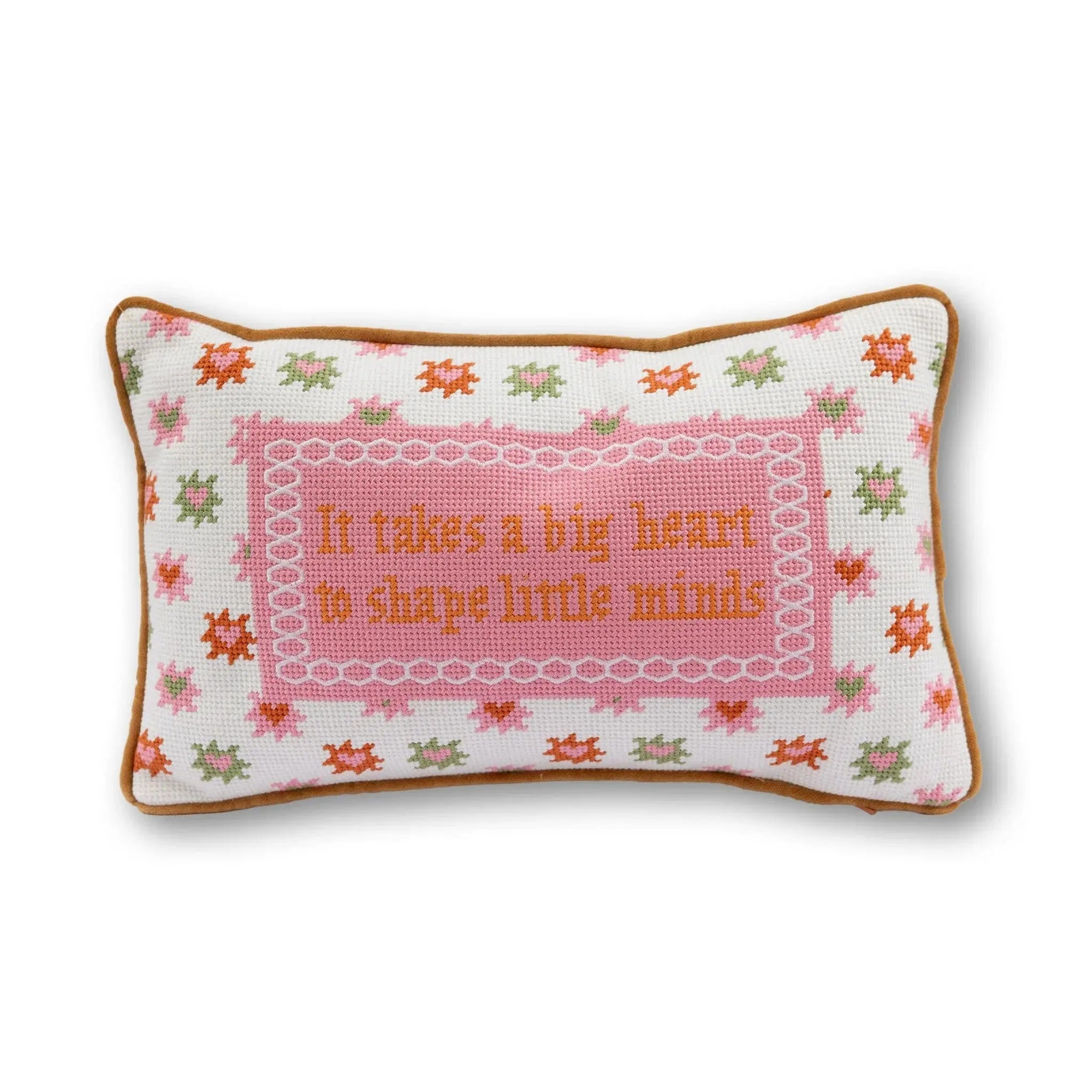 Decorative pillow with embroidered text and floral patterns on a white background