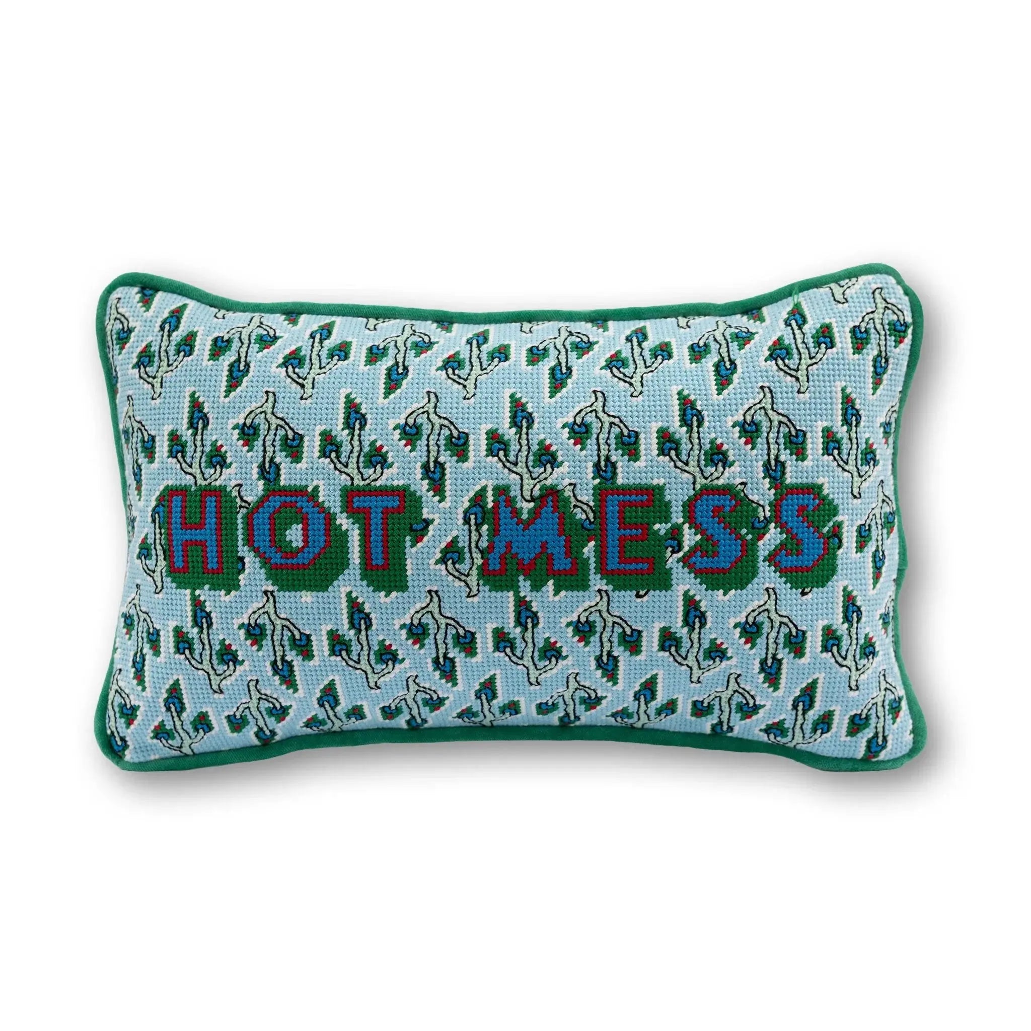 Decorative pillow with 'HOT MESS' text on a light blue background