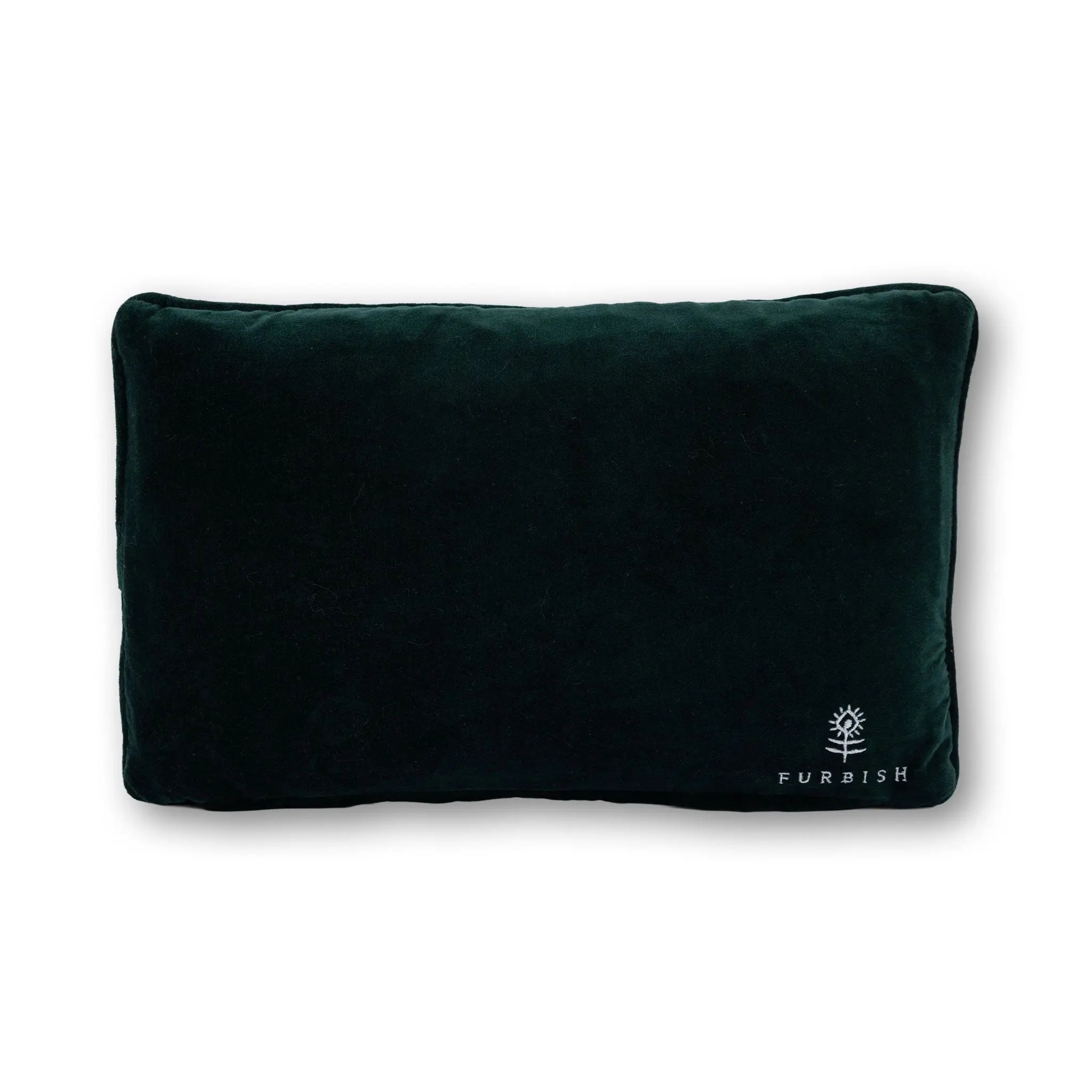 Dark green pillow with 'Furbish' logo on a white background