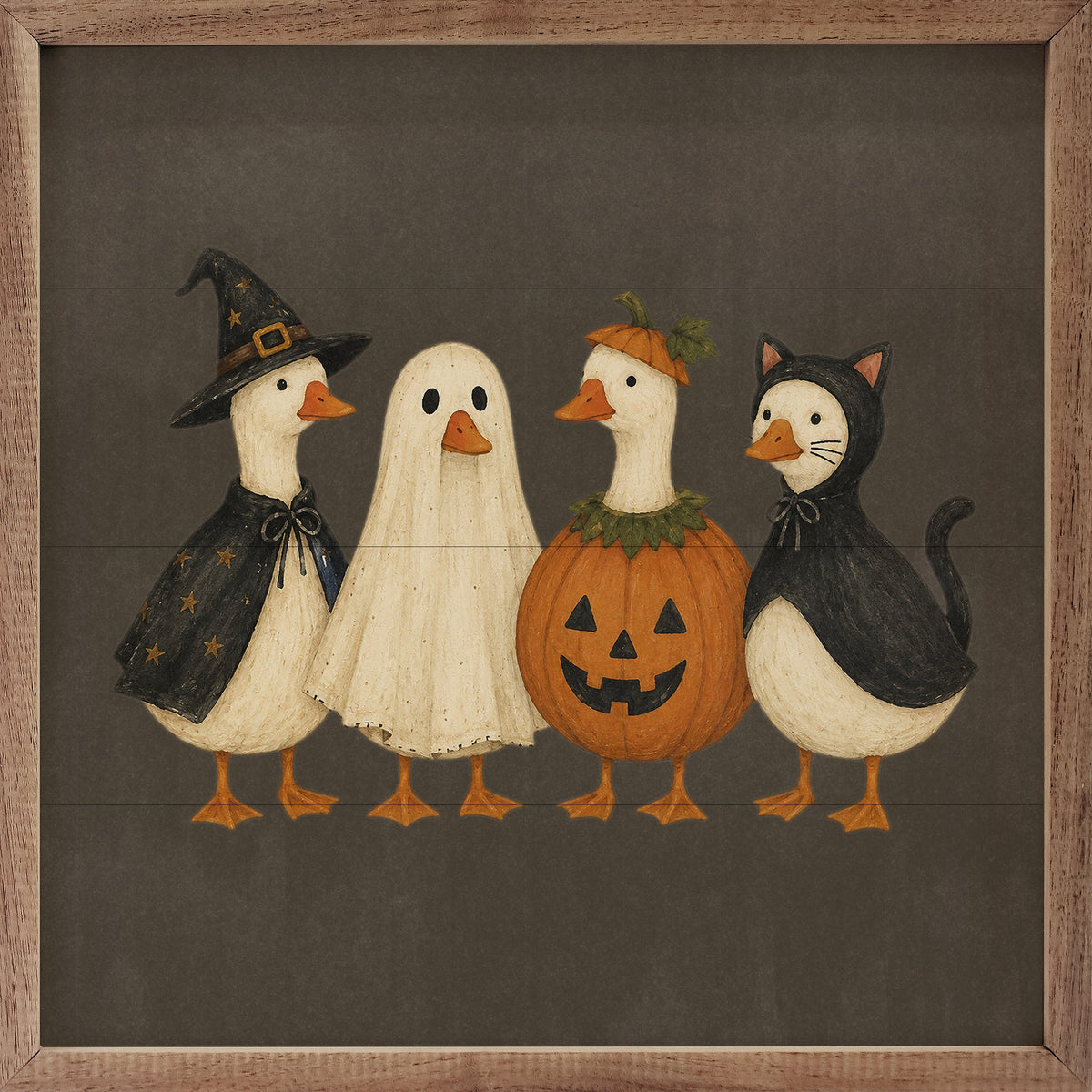 Framed square wall art featuring four cartoon ducks dressed in Halloween costumes: a witch, a ghost, a jack-o'-lantern, and a cat. The artwork is set on a dark gray background with a rustic wood frame.