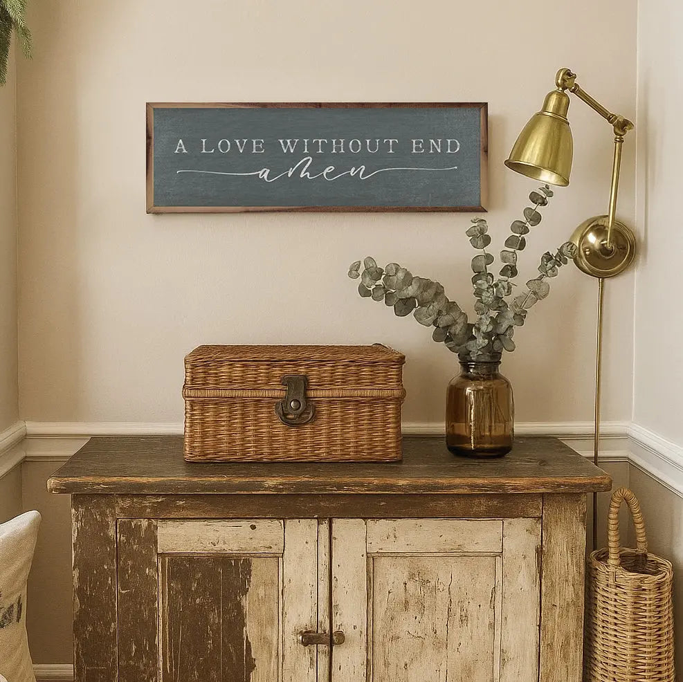 Nostalgic interior with wicker chest, vase with eucalyptus, and framed quote on wall.