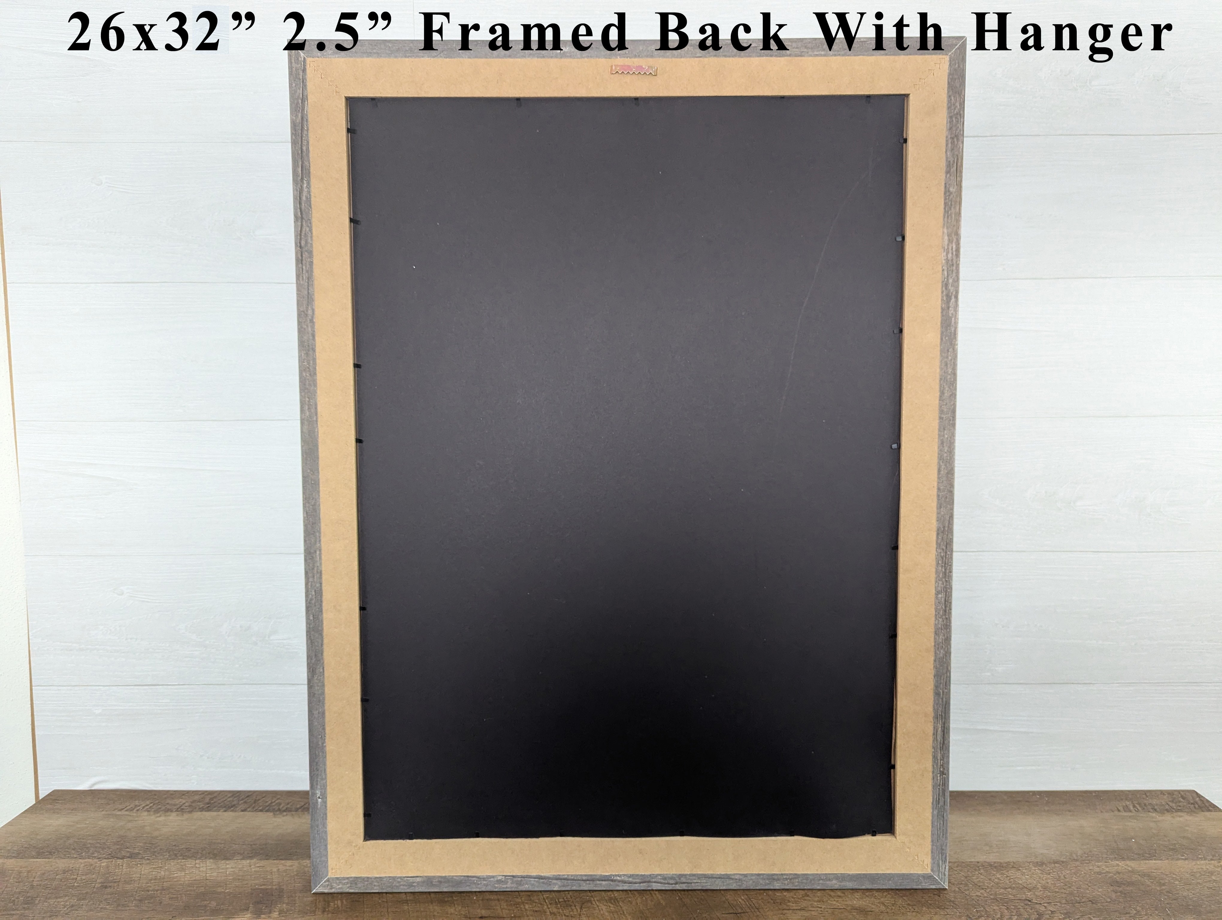 Black chalkboard with wooden frame and hanger on a white background