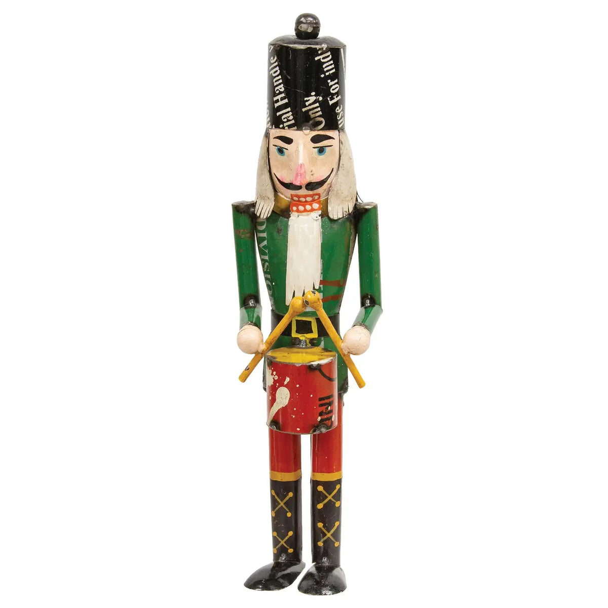 Hand-painted wooden Christmas nutcracker figurine with a black hat, green jacket, white shirt, and red pants, holding a gold drumstick bundle, isolated on a white background.