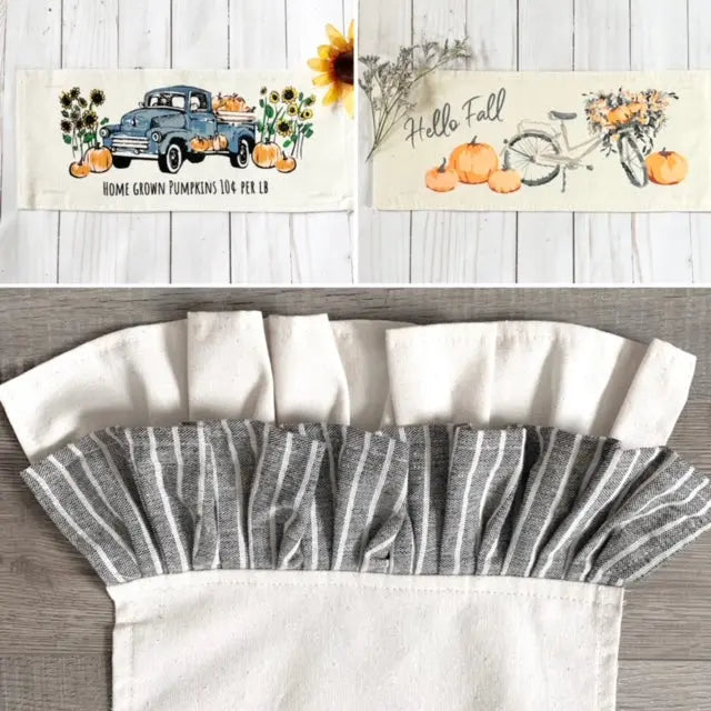 Two rectangular fall-themed fabric runner napkins are shown above a close-up of a matching napkin. The top napkin has a vintage blue pickup truck carrying pumpkins with sunflowers and the text 'Home Grown Pumpkins 100% Pure Love.