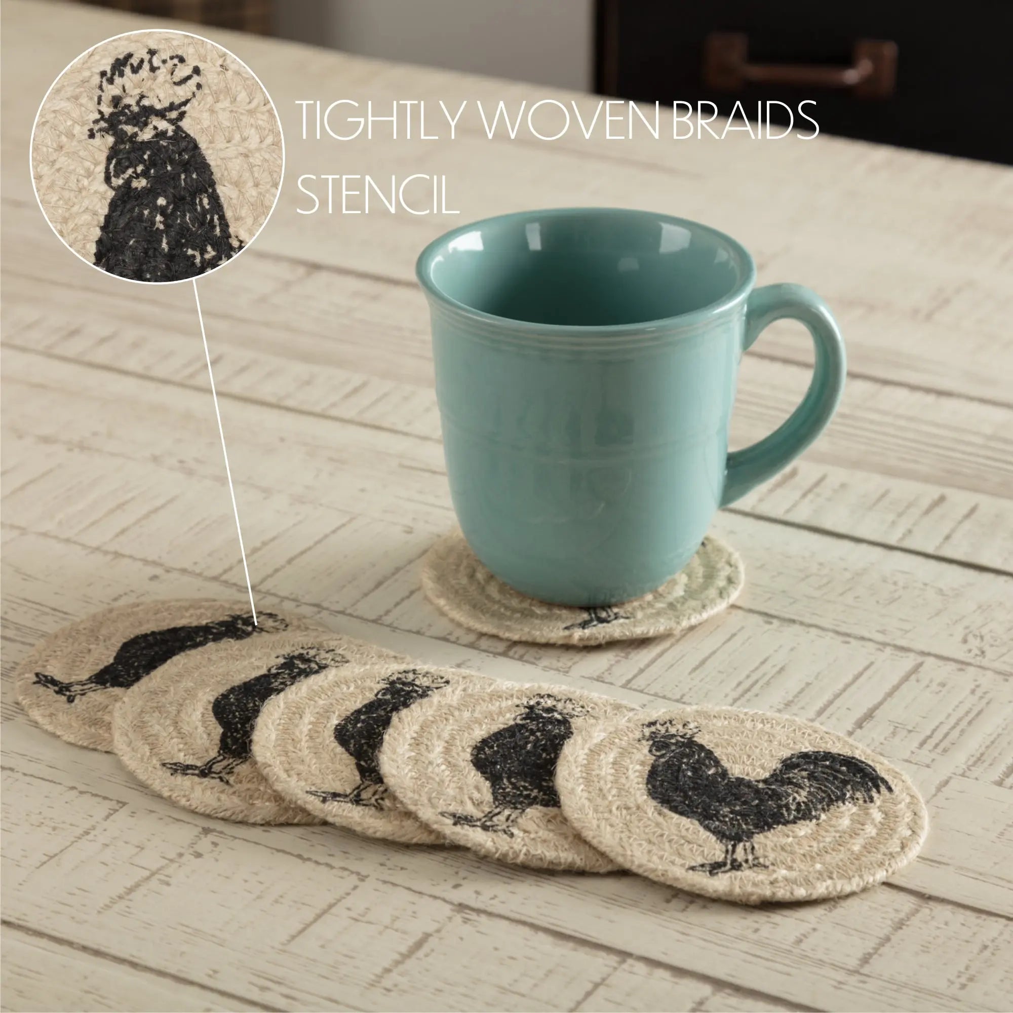 Set of rooster-stenciled coasters with a teal mug on a wooden surface