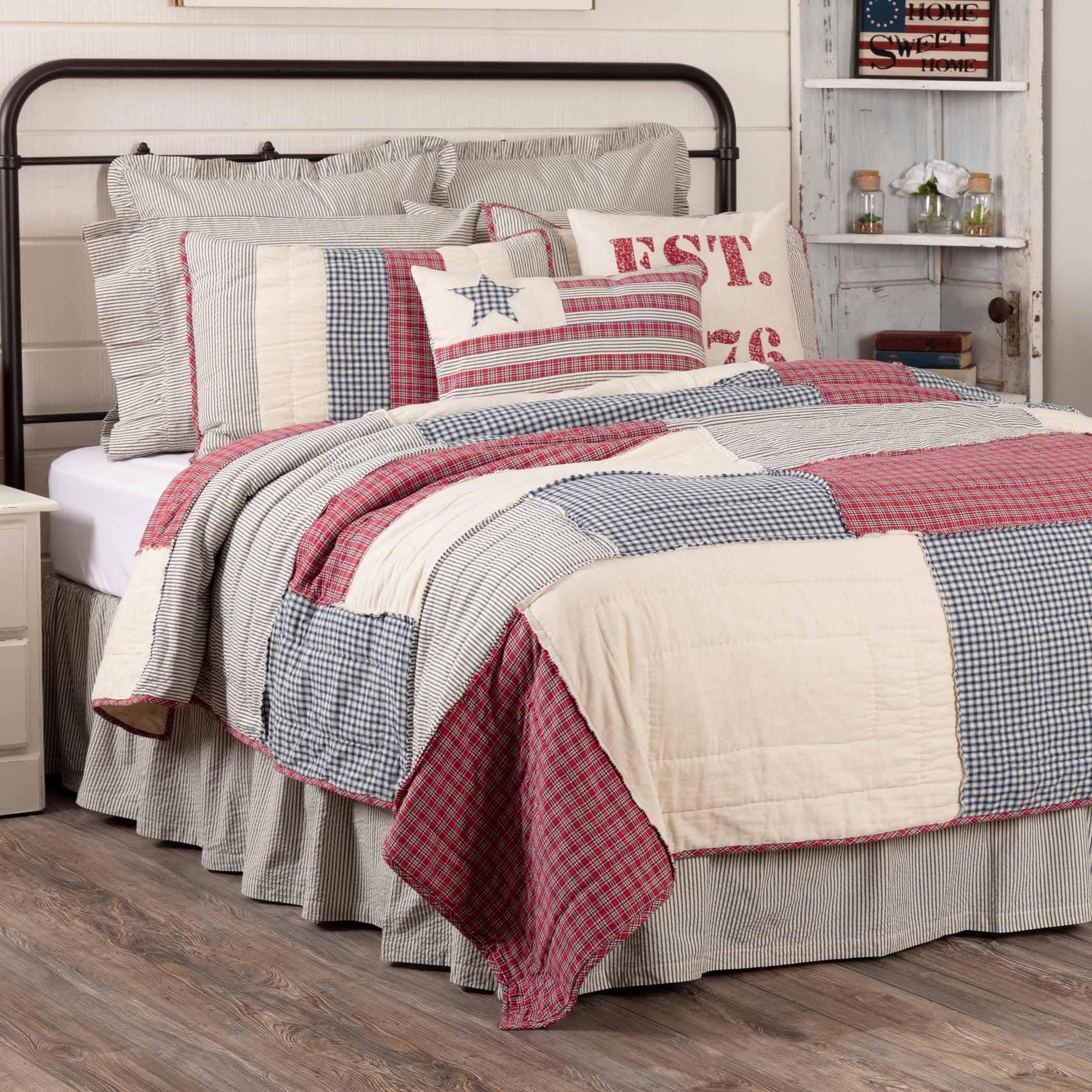 Red, white, and blue patchwork quilt set with star pillow, farmhouse bedroom decor