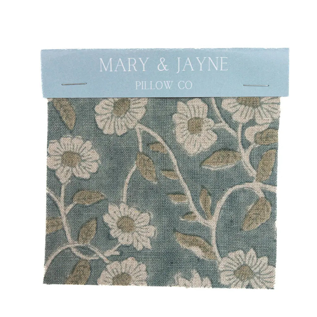 Floral patterned fabric swatch with 'Mary & Jayne Pillow Co' label on a white background