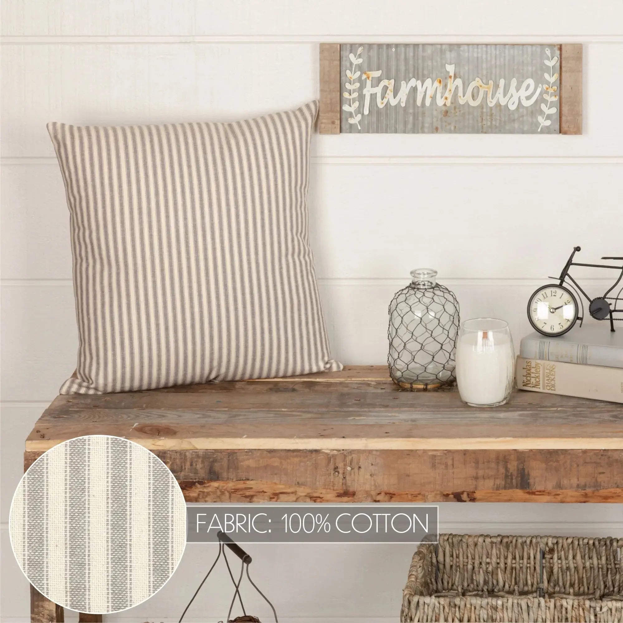 Striped cotton throw pillow on rustic wood bench with farmhouse sign, candle, and decor