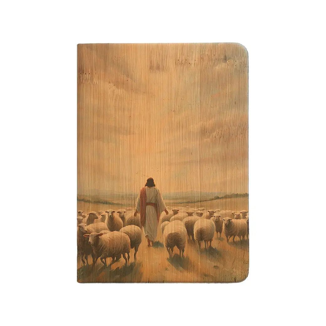 Notebook with a design of a shepherd walking among sheep on a wooden cover
