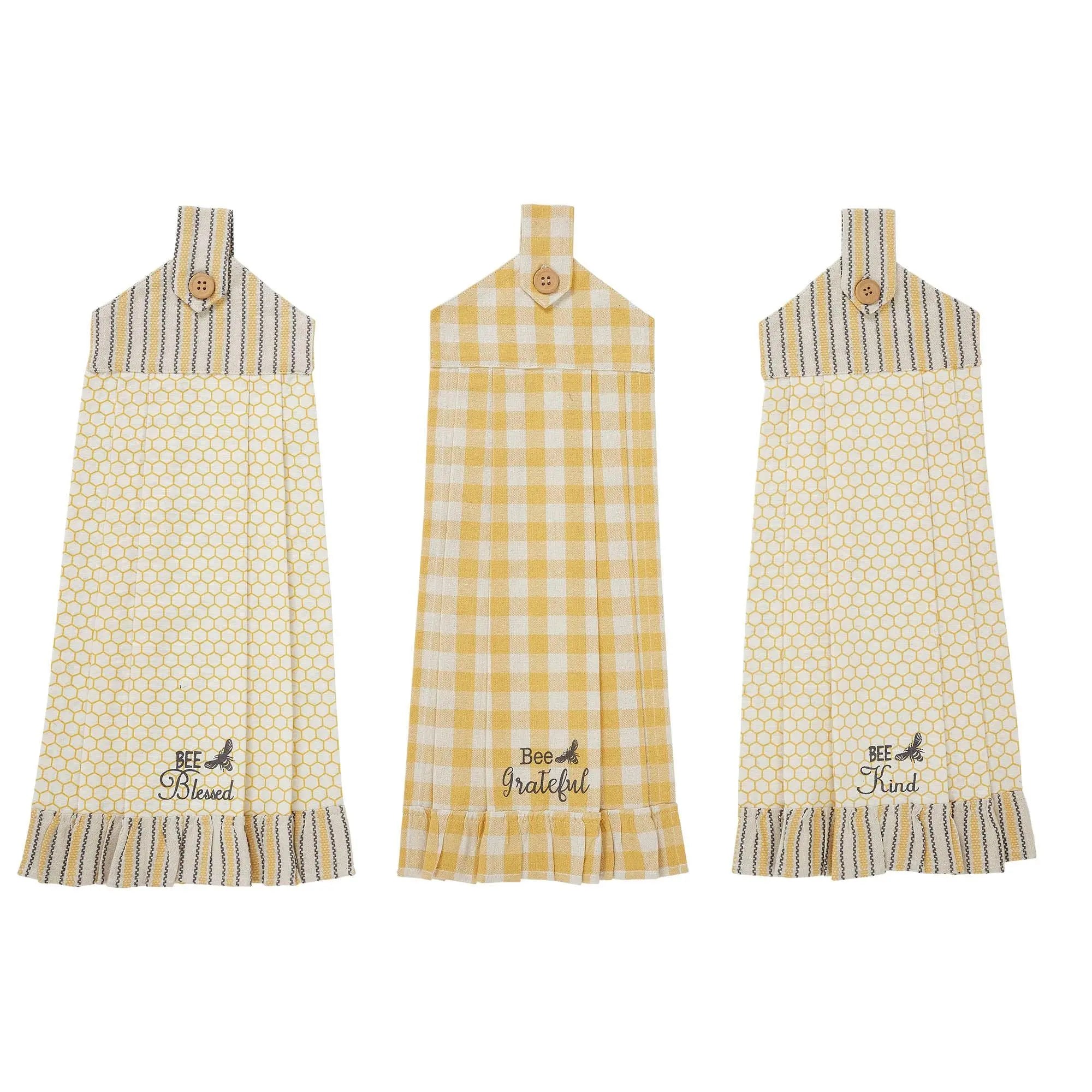Yellow and white farmhouse kitchen towels with bee quotes, honeycomb and gingham patterns, ruffled edges