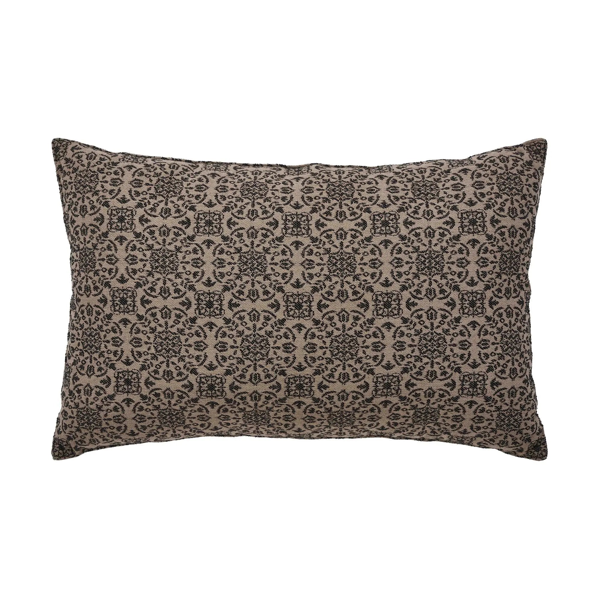 Farmhouse style decorative pillow with black floral pattern on beige background, cozy cottage home decor