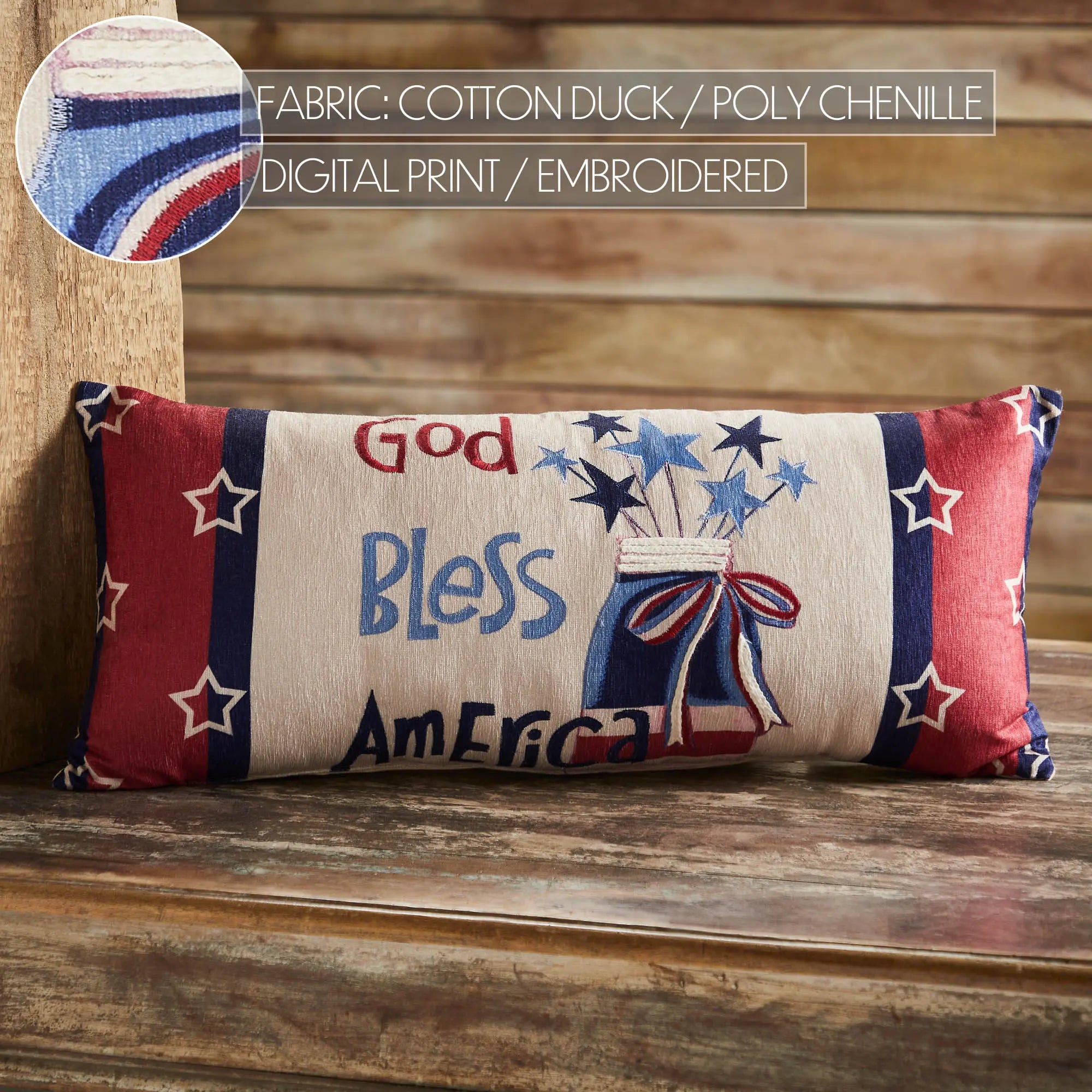 Decorative pillow with 'God Bless America' text on a wooden surface