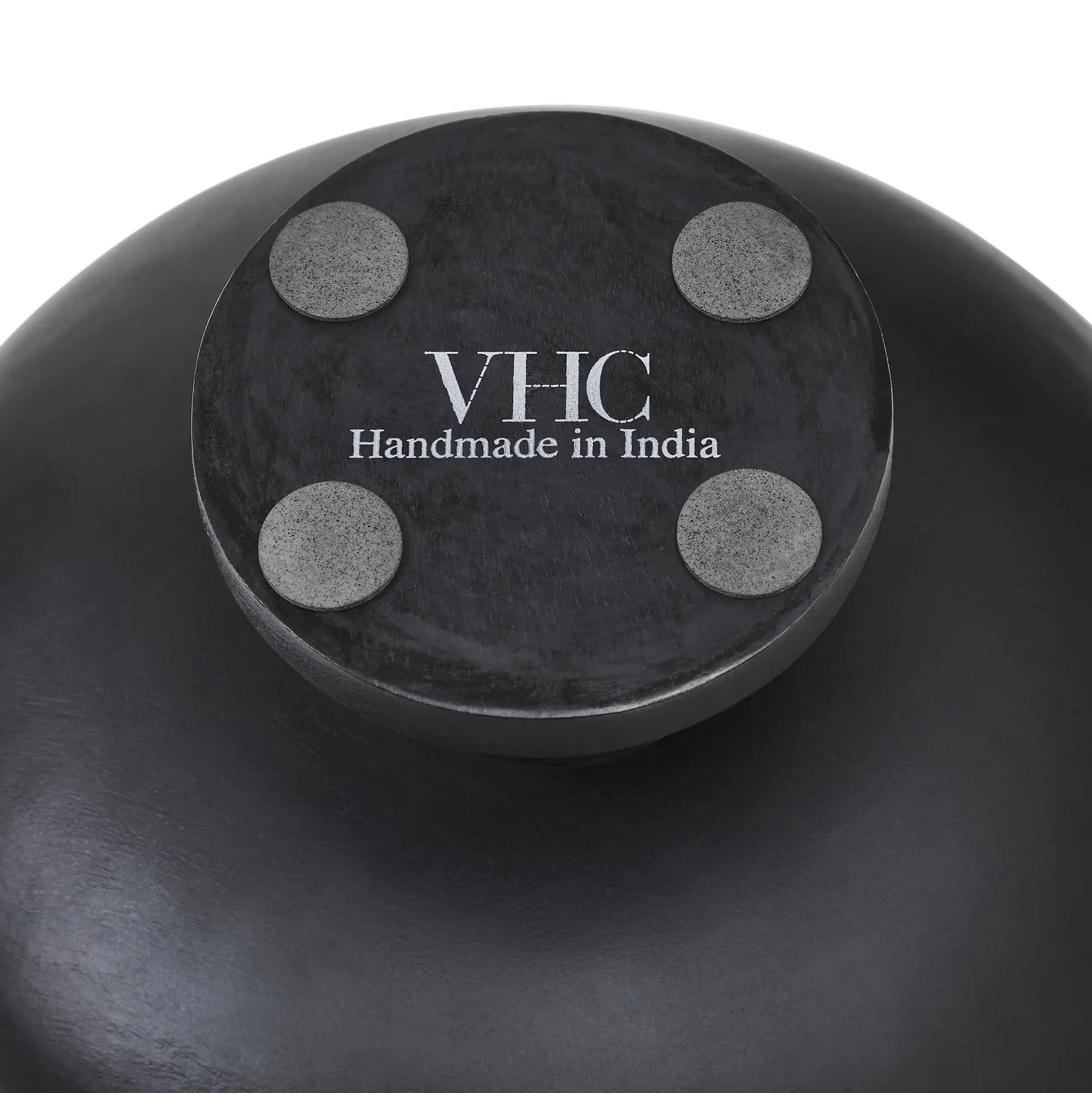 Black container with 'VHC Handmade in India' label on a white background