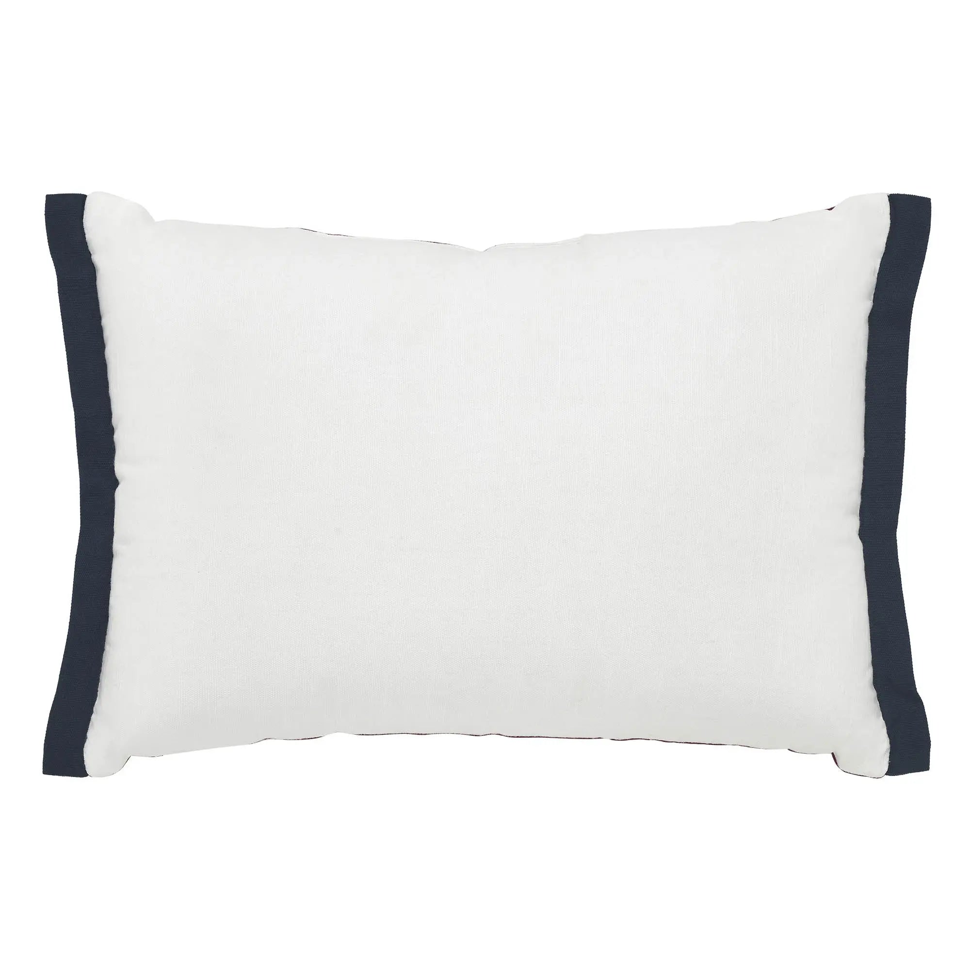 White pillow with navy blue edges on a white background