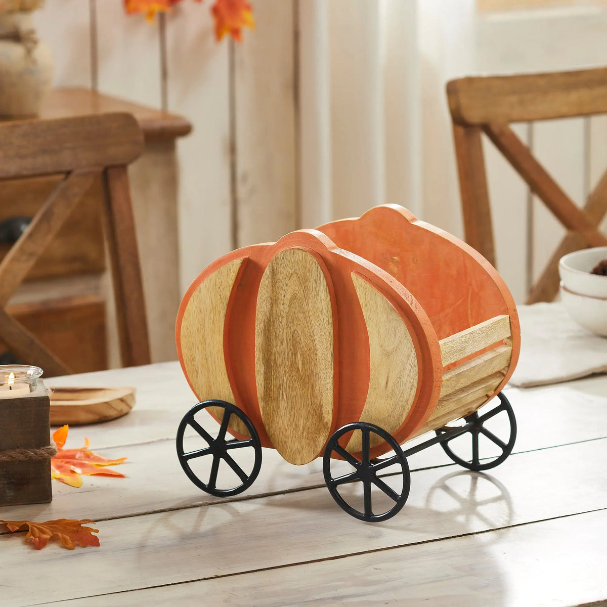 Decorative wooden wagon on a table with a cozy indoor setting