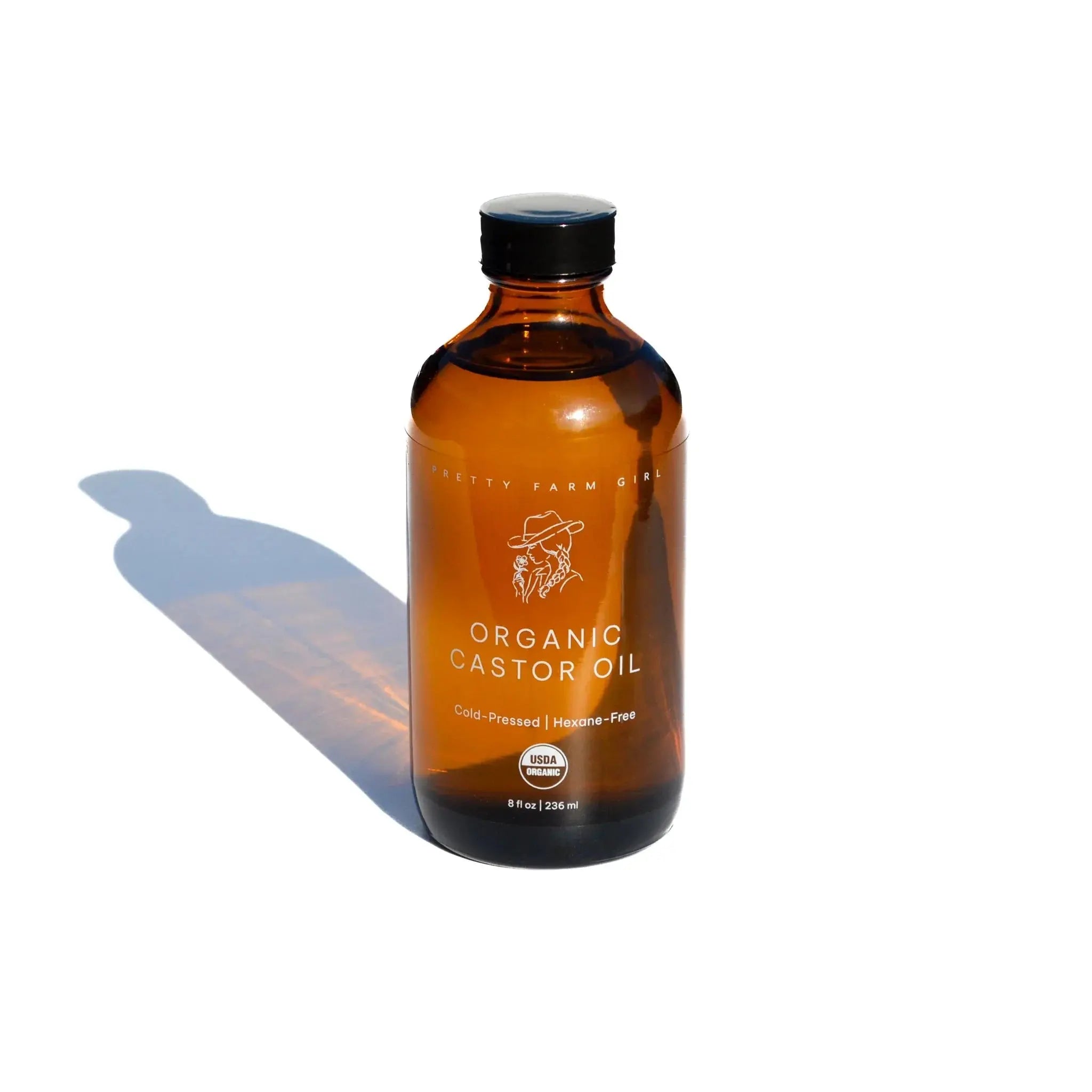 Organic castor oil in amber glass bottle, cold-pressed, USDA certified, for natural skincare and haircare