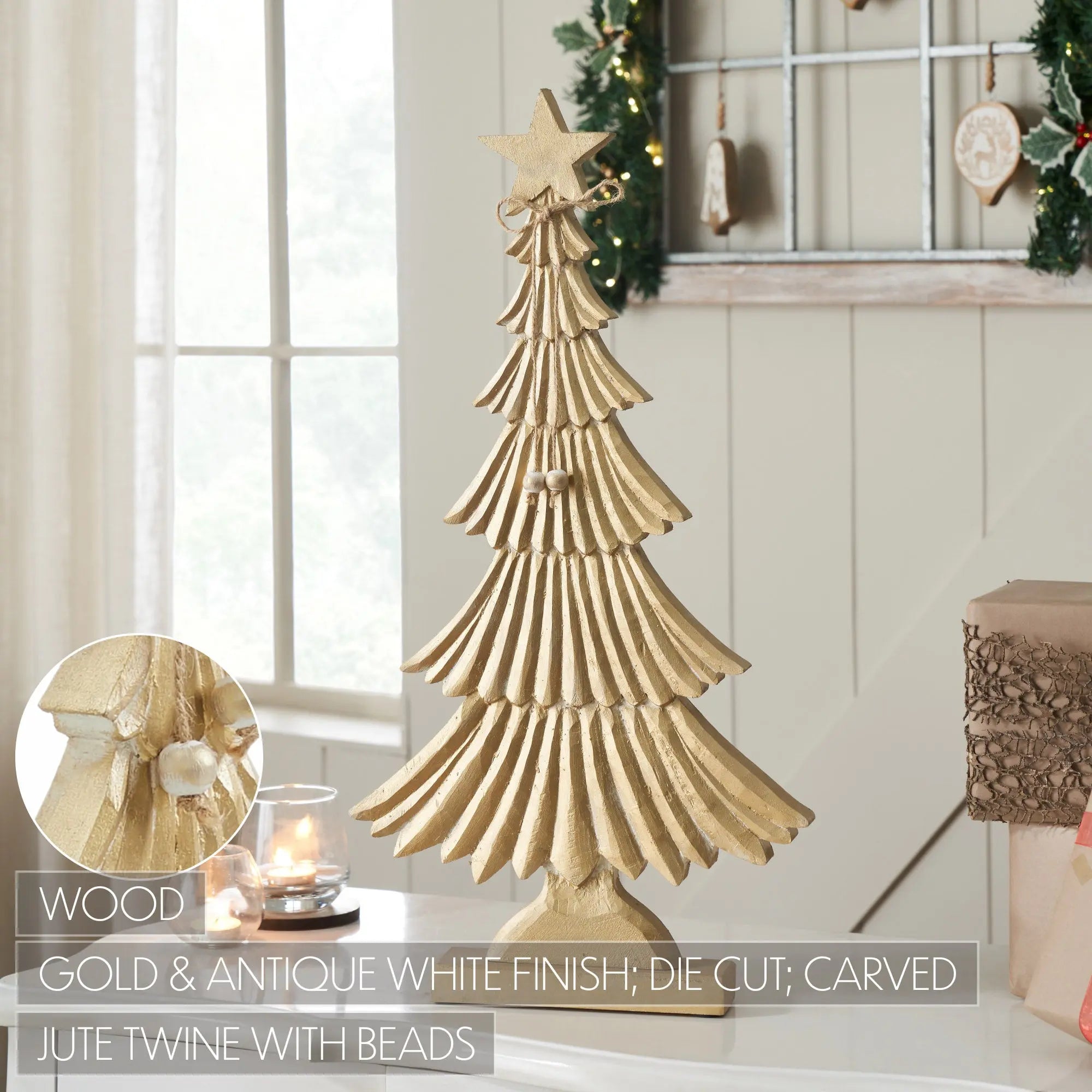 A decorative wooden Christmas tree with a gold and antique white finish, featuring carved details, hanging beads, and a star topper. The image is set in a cozy, decorated home interior with a window, holiday garlands, and a candle, with text overlays highlighting the wood material and finish.