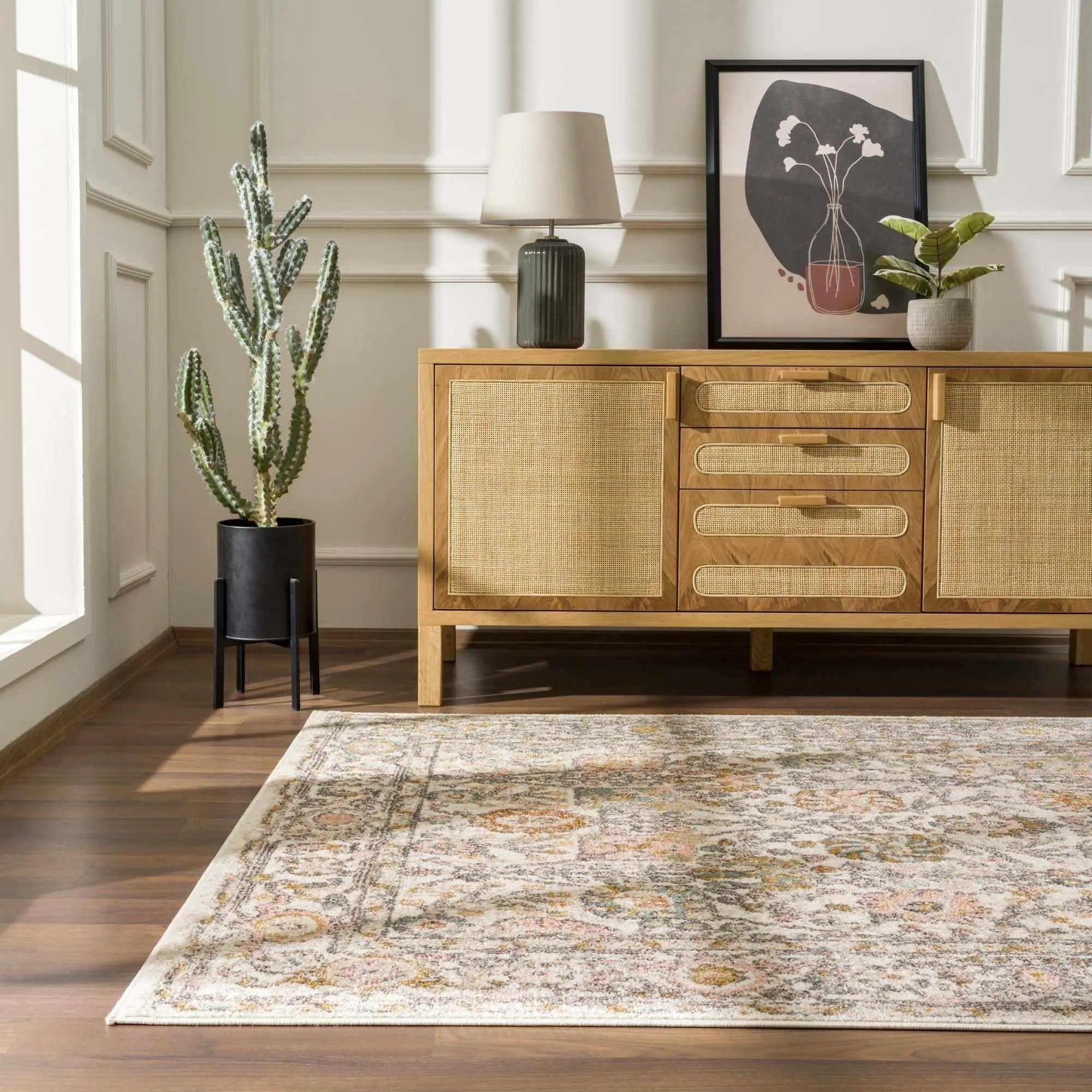 Cozy farmhouse-style area rug with vintage pattern, paired with wooden sideboard and potted cactus decor