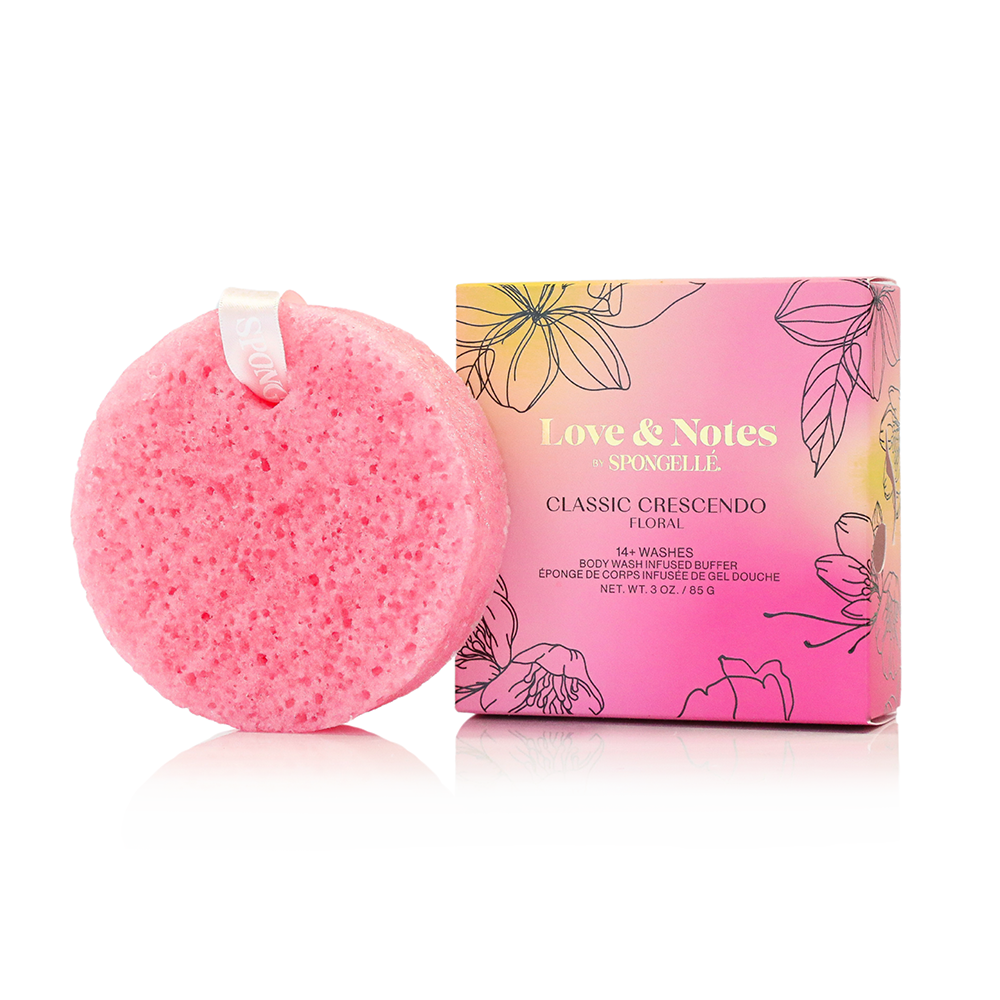 Pink bath bomb with floral packaging on a white background