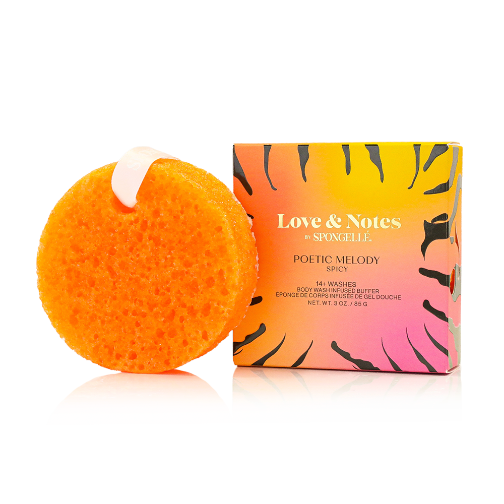 Orange exfoliating sponge next to a colorful box labeled 'Love & Notes' on a white background