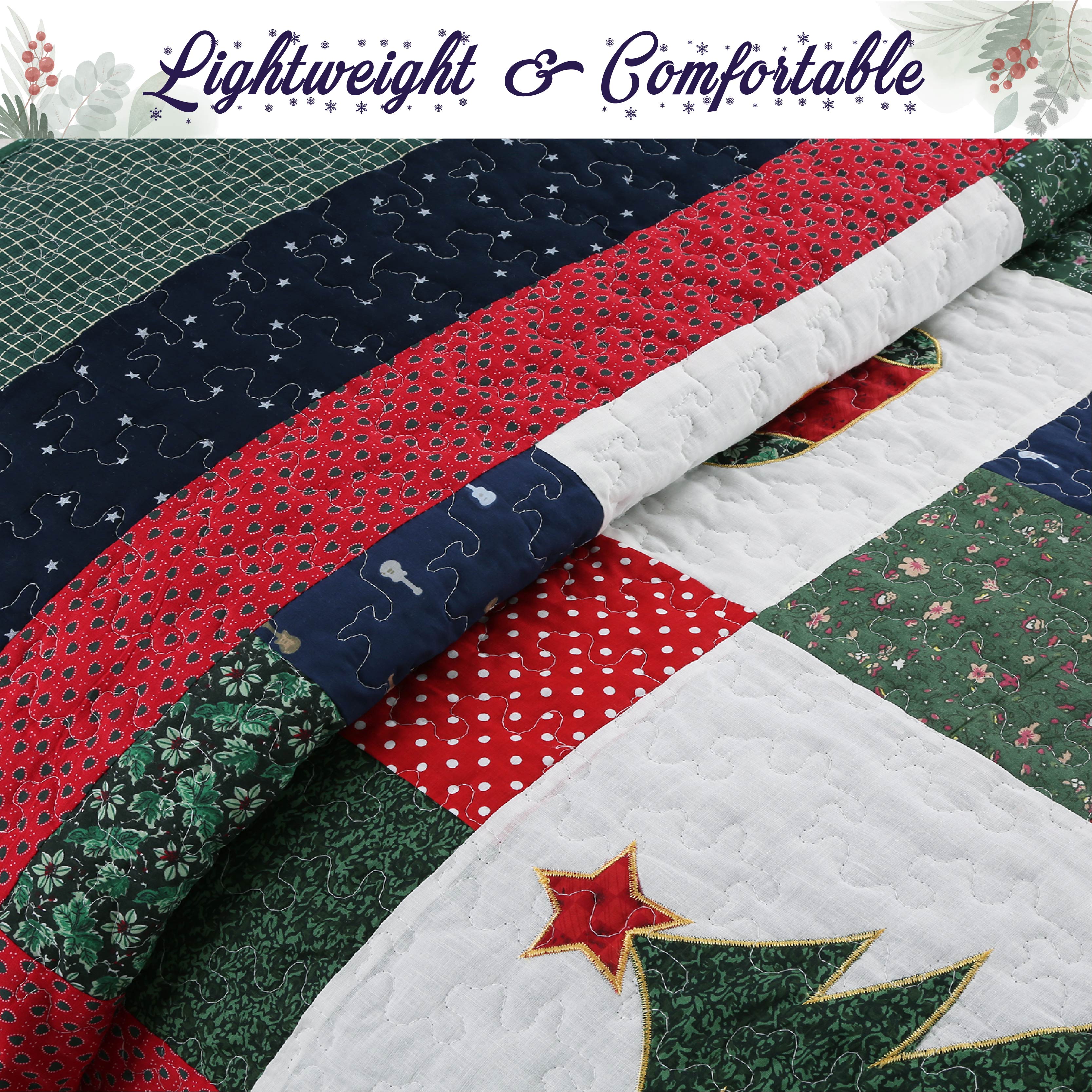 A close-up of a quilted patchwork textile with Christmas-themed patterns, including red polka dot sections, green floral sections, a navy star-patterned band, and a white quilted area with a red star motif. A banner at the top reads 'Lightweight & Comfortable'.