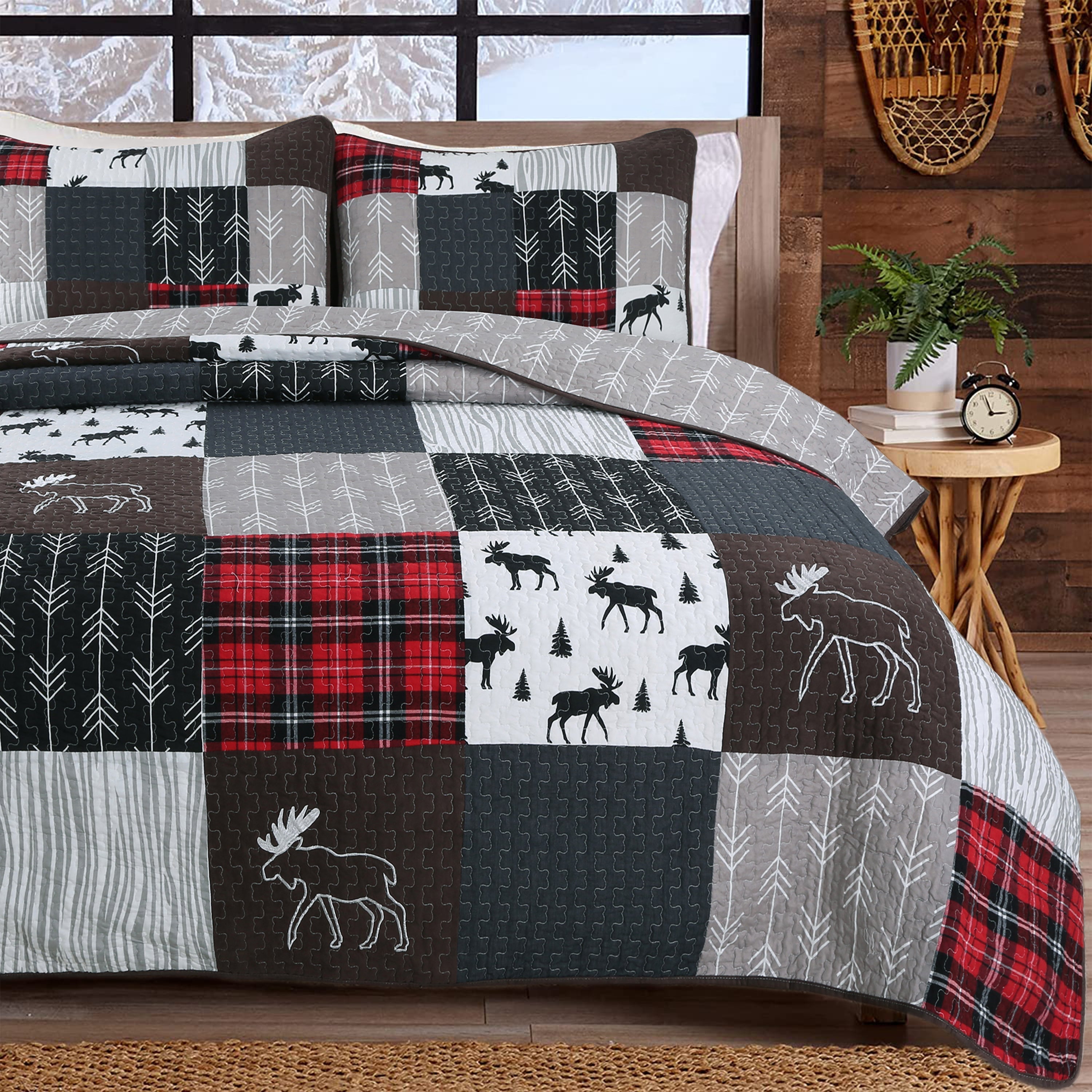 Moose Lodge rustic cabin reversible quilt bedding set with authentic patchwork, moose motifs, black accents, and matching shams in a cozy lodge-style bedroom.