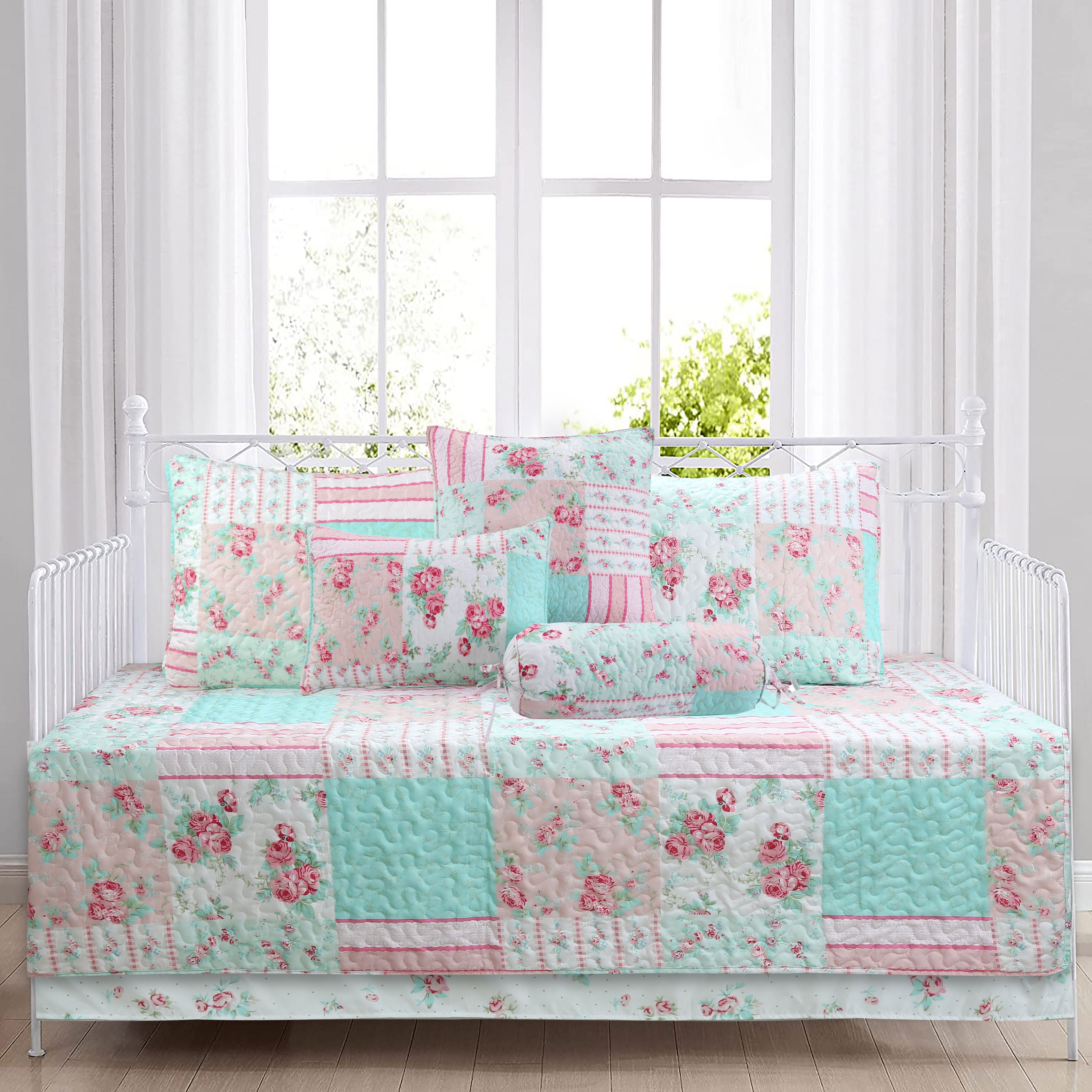 Tiffany Pink Blossom floral patchwork reversible daybed bedding set with pink floral quilt, matching shams, bed skirt, and decorative throw pillows in a cozy cottage bedroom.