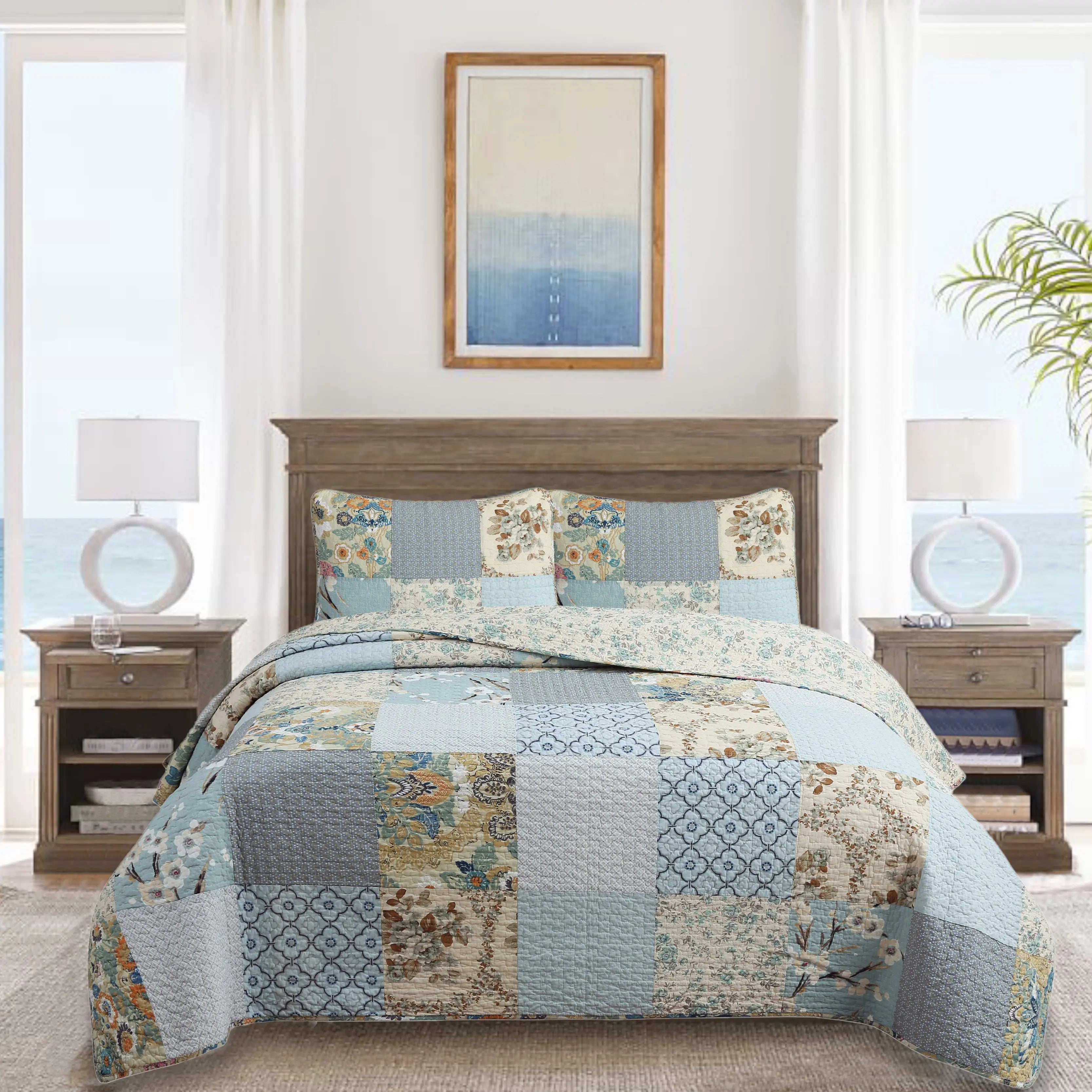 Sky blue floral patchwork reversible 100% cotton quilt bedding set with matching shams for farmhouse and cottage bedrooms.