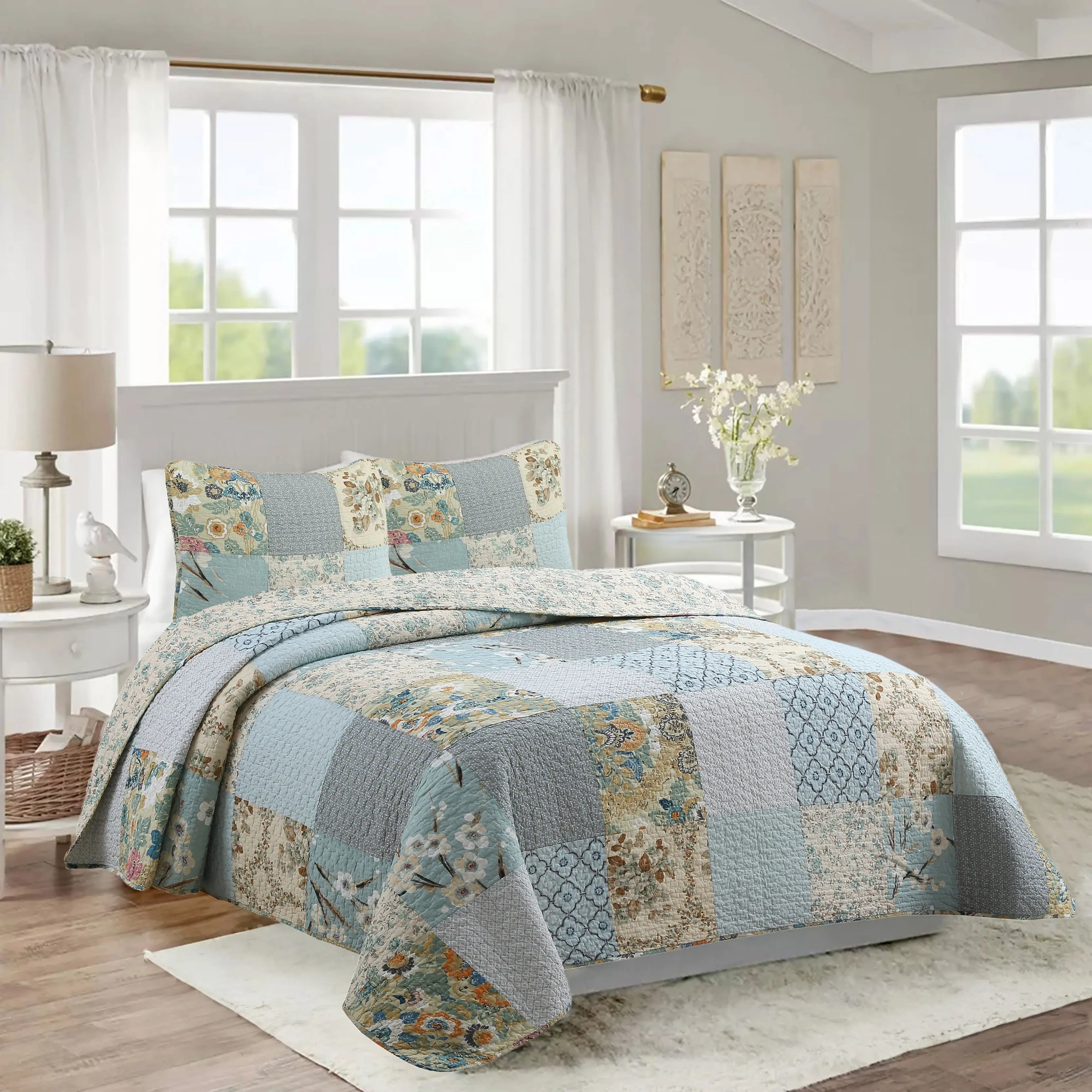 Sky blue floral patchwork reversible 100% cotton quilt bedding set with matching shams for farmhouse and cottage bedrooms.
