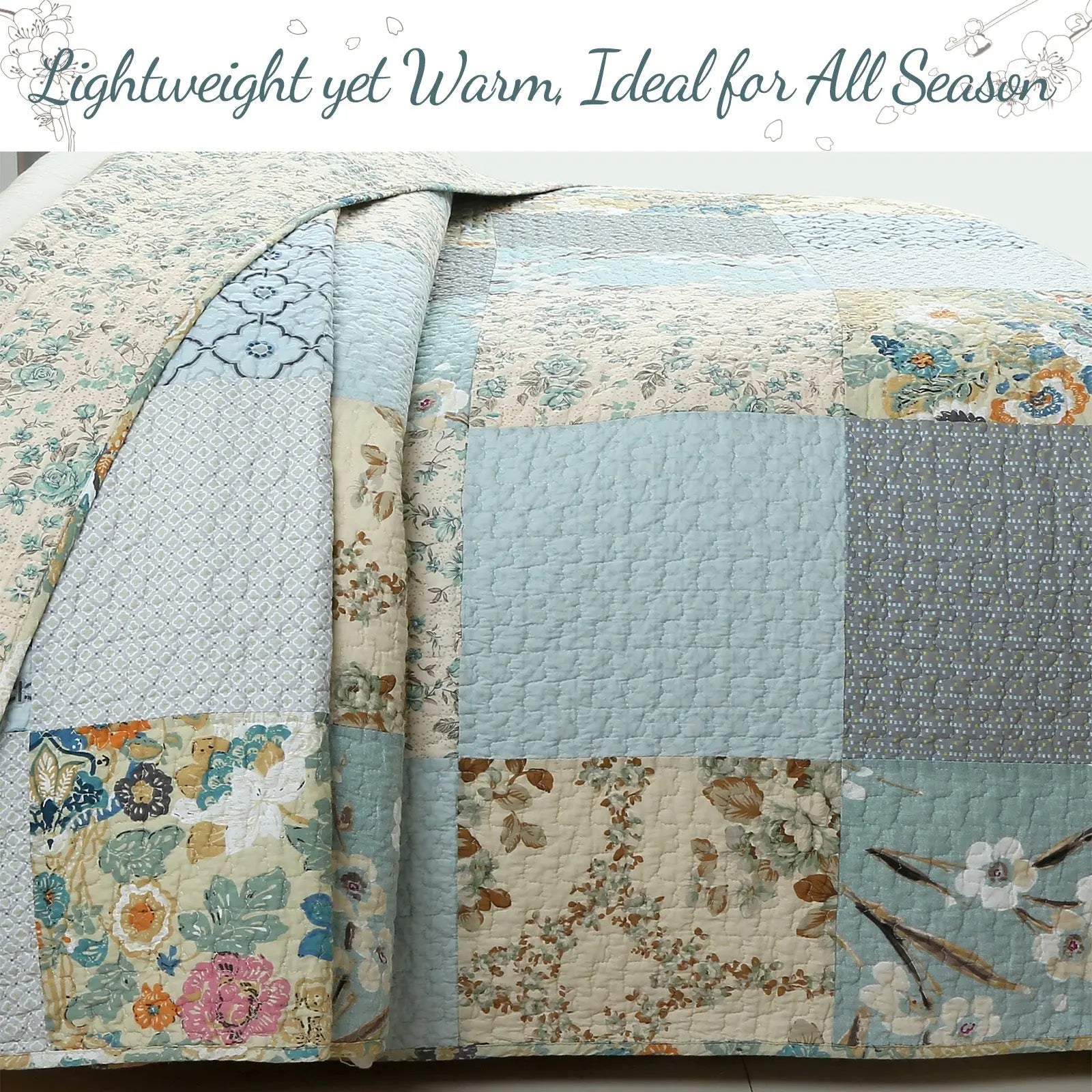 Sky blue floral patchwork reversible 100% cotton quilt bedding set with matching shams for farmhouse and cottage bedrooms.