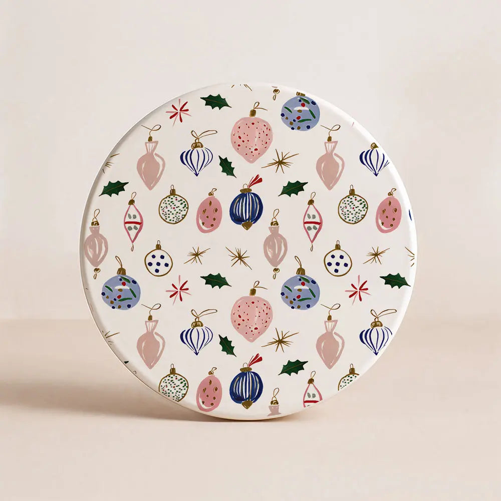 Decorative plate with colorful Christmas ornament pattern on a beige background