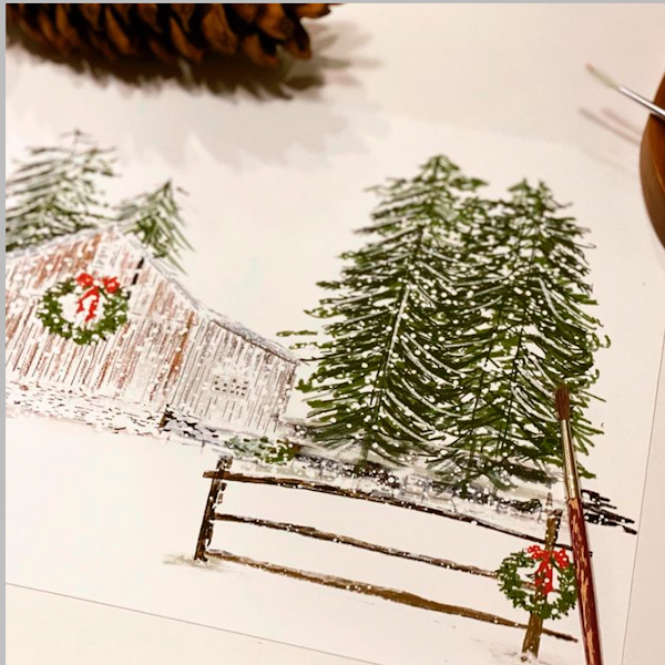 Winter scene with a cabin, trees, and Christmas wreaths on a snowy landscape.