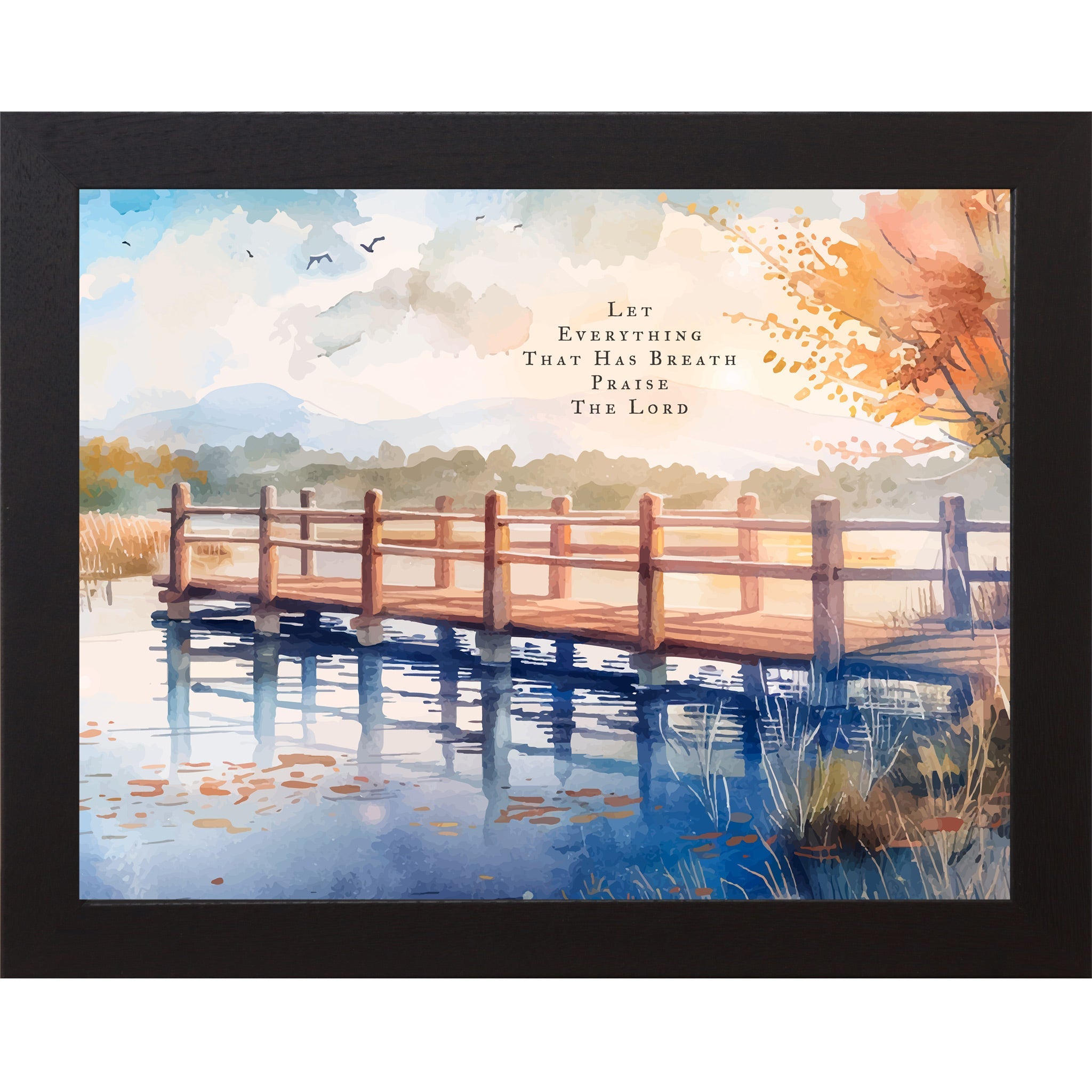 Framed artwork of a wooden bridge over water with autumn leaves and a quote.