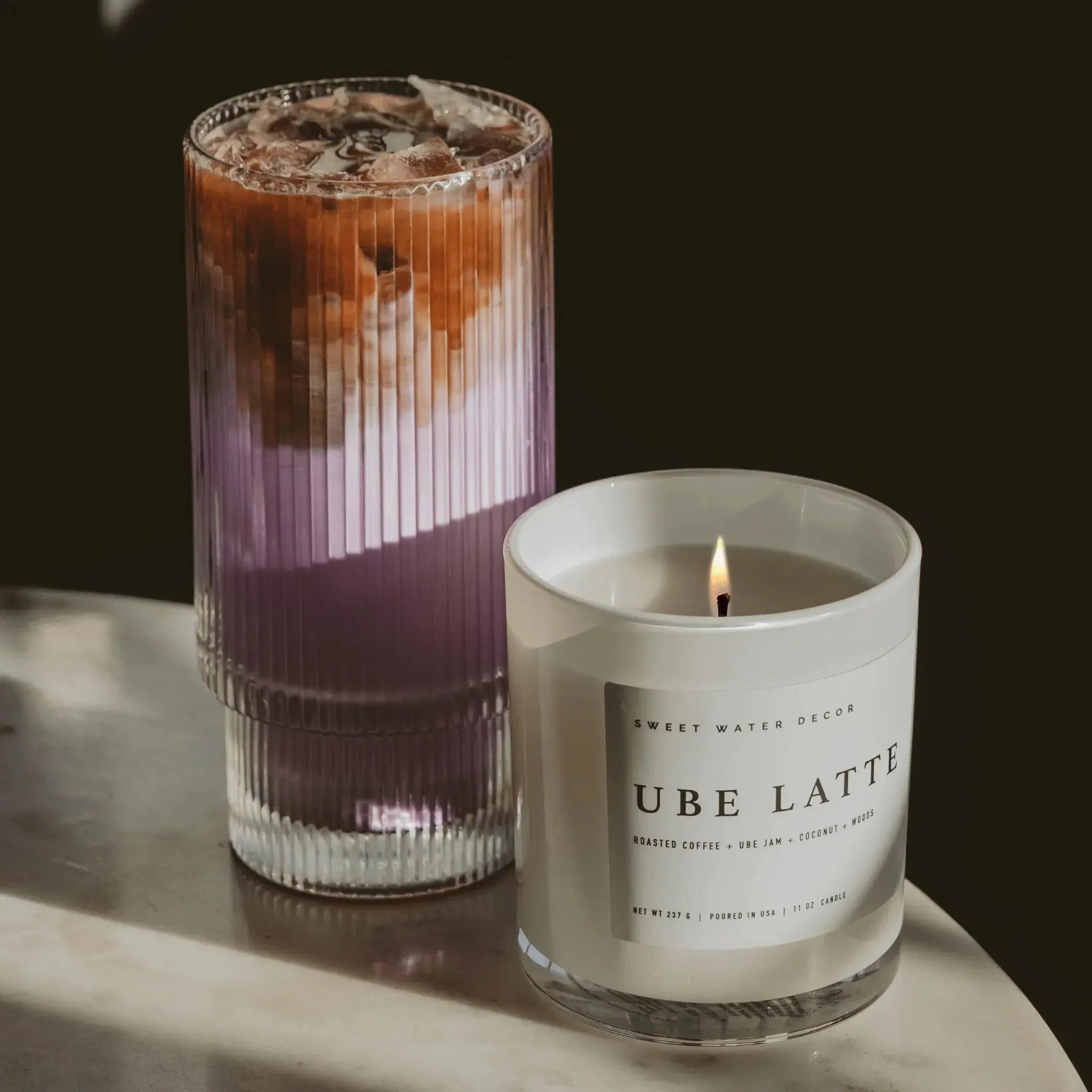 Ube Latte scented candle beside iced coffee drink, cozy farmhouse home decor