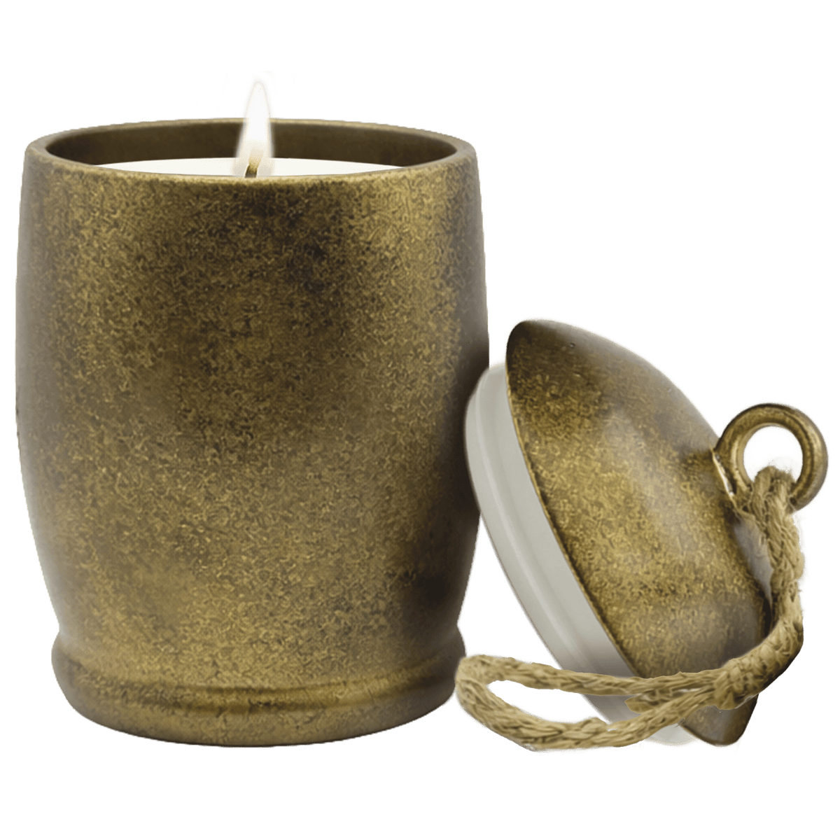 A small candle in a textured metallic bronze pot with a wick and visible flame, shown next to its matching lid on a solid green background.