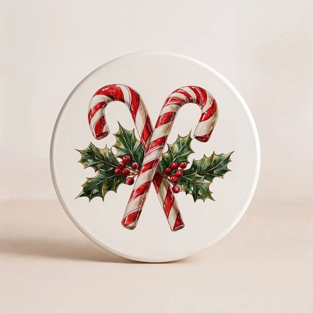 Round ceramic coaster with candy canes and holly design on a beige background