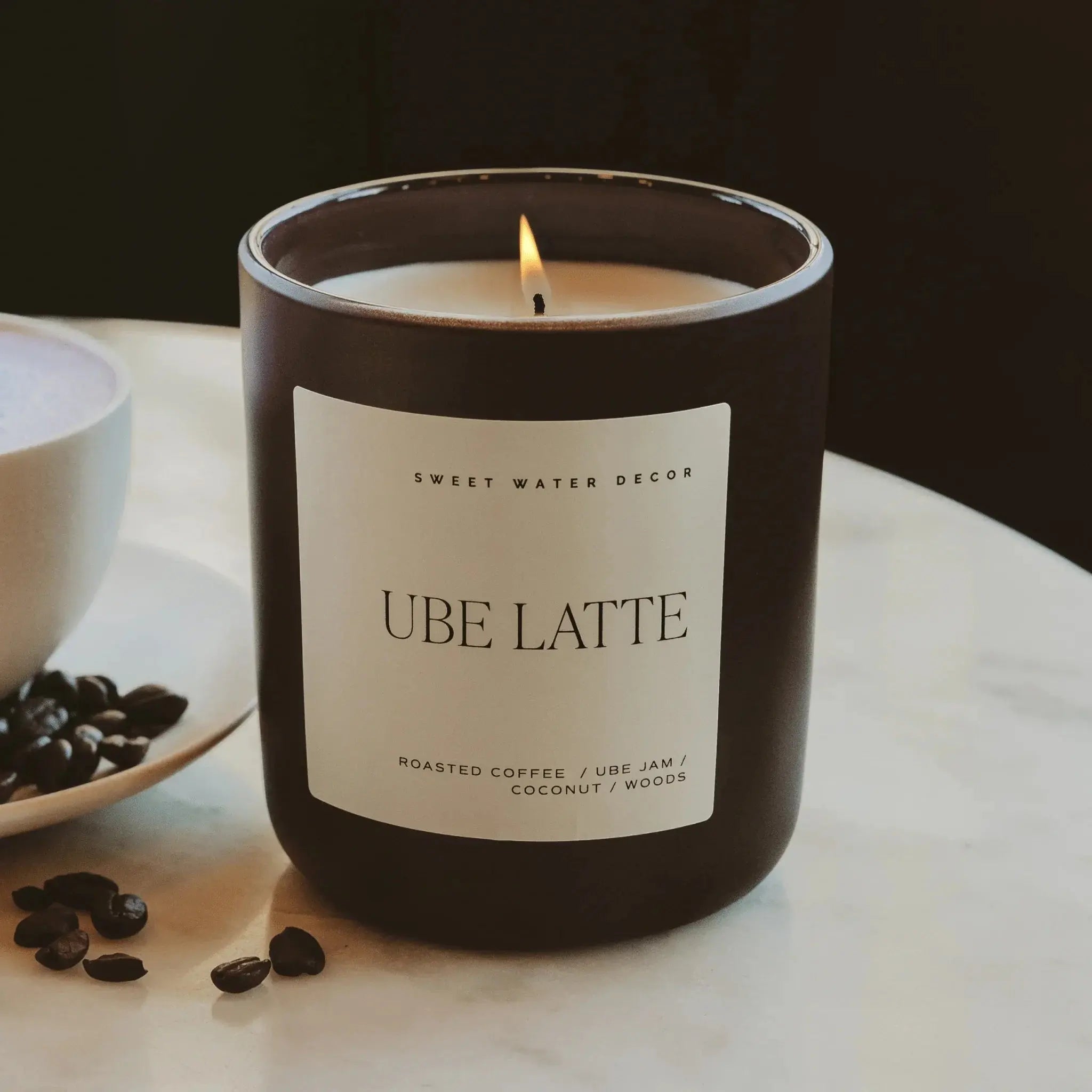 Ube Latte scented candle with roasted coffee notes, cozy home decor on marble surface