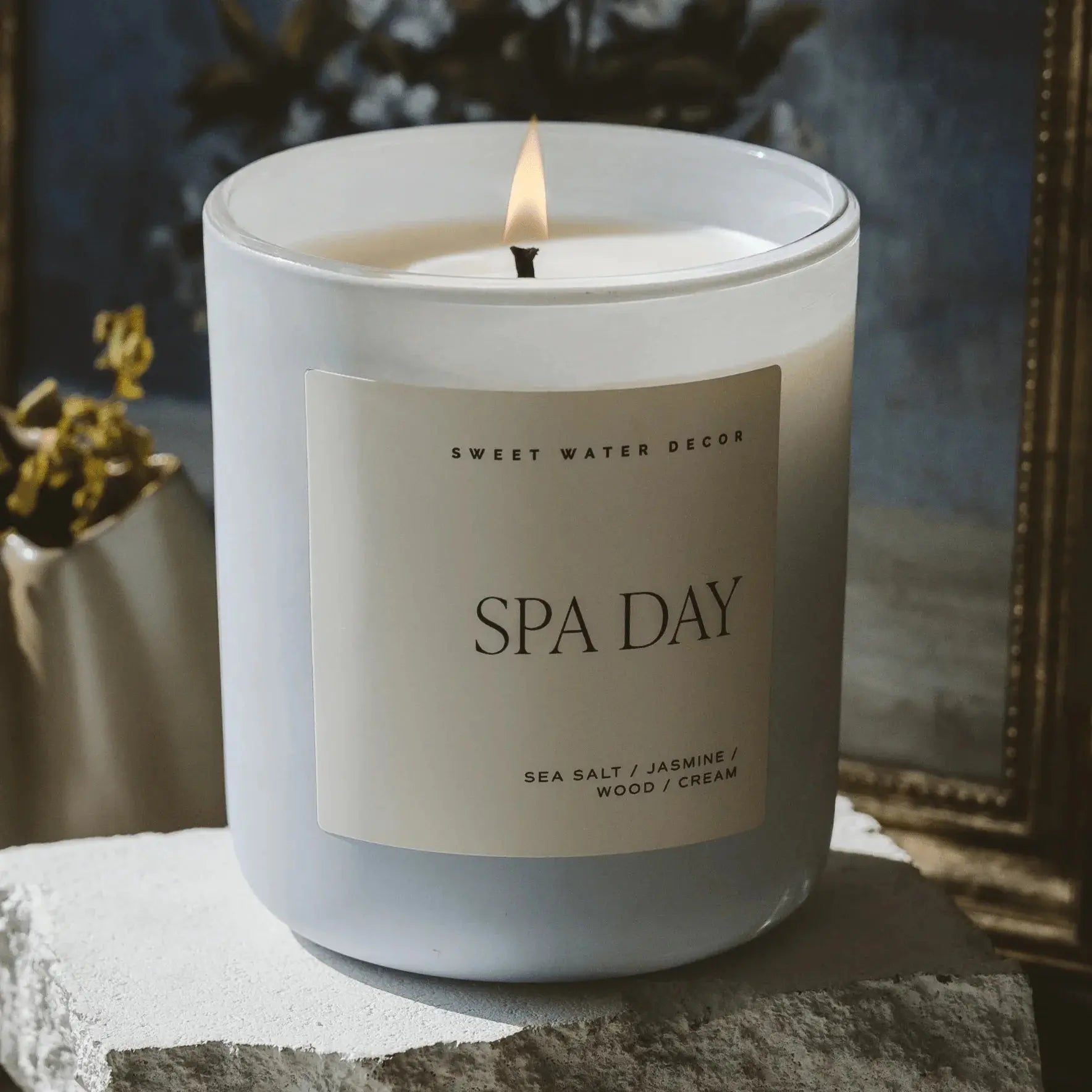 Spa Day scented candle with sea salt, jasmine, wood, and cream notes, perfect for cozy home decor