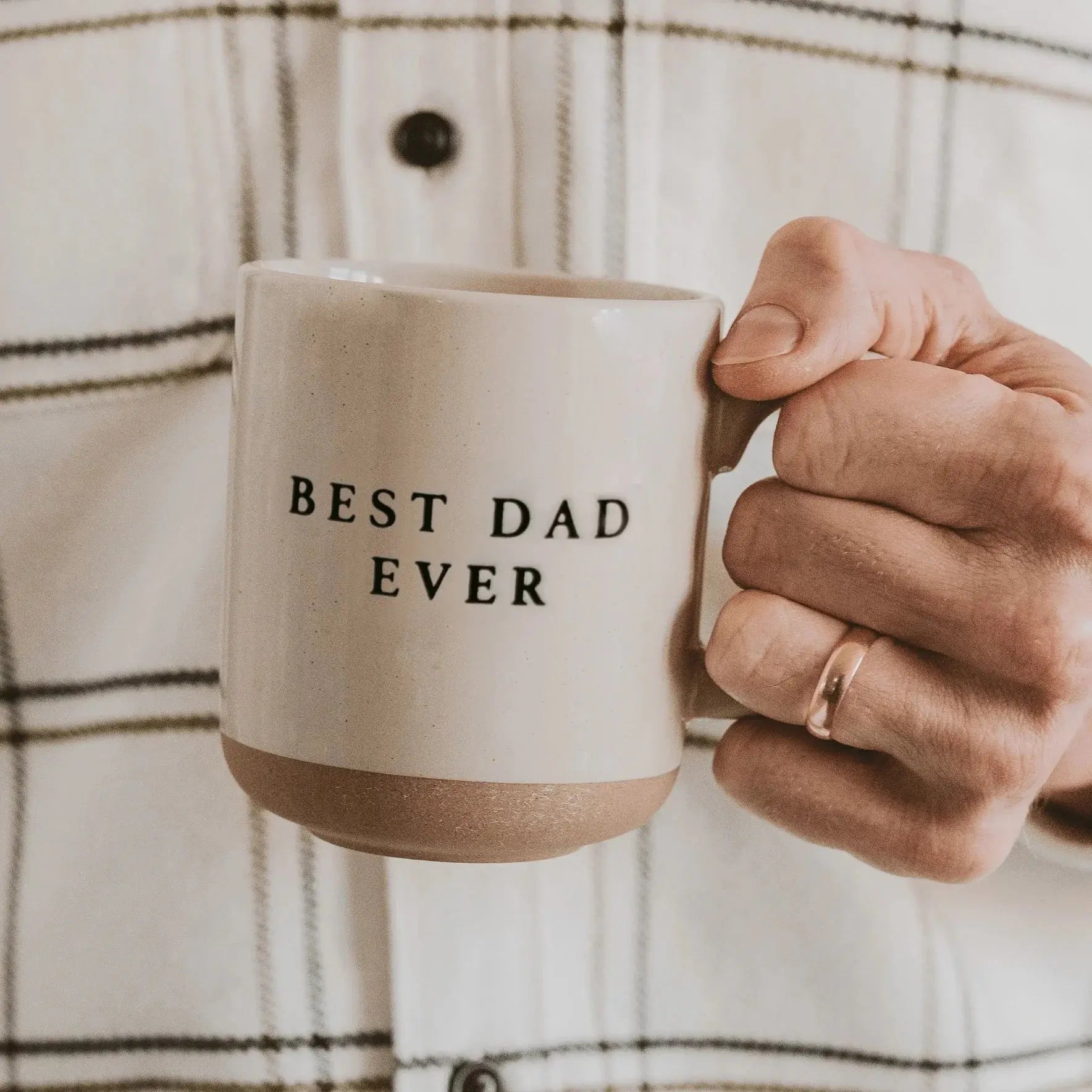 Best Dad Ever ceramic mug, cozy farmhouse style gift for father, held in hand against plaid shirt
