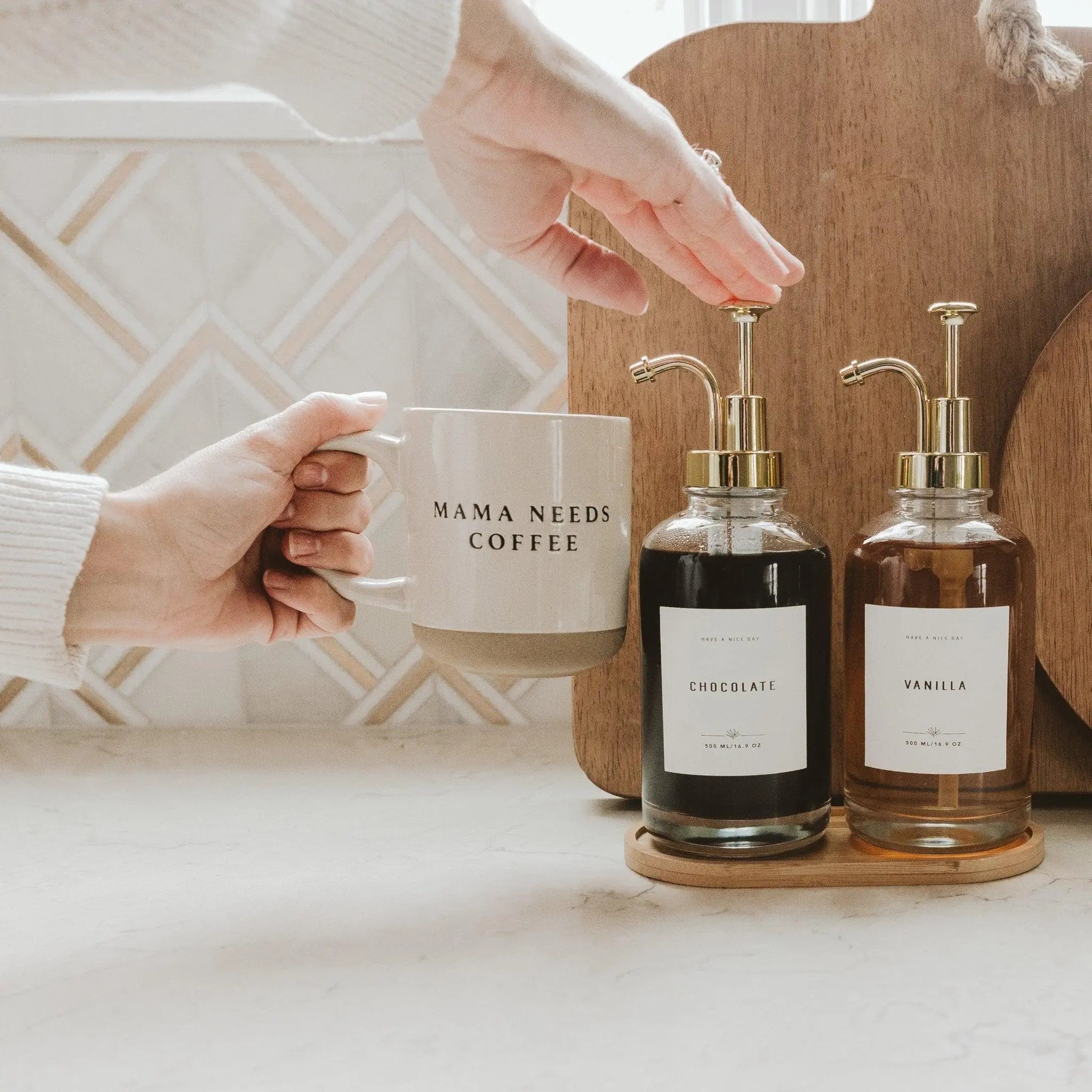 Mama needs coffee mug with chocolate and vanilla soap dispensers in cozy farmhouse kitchen