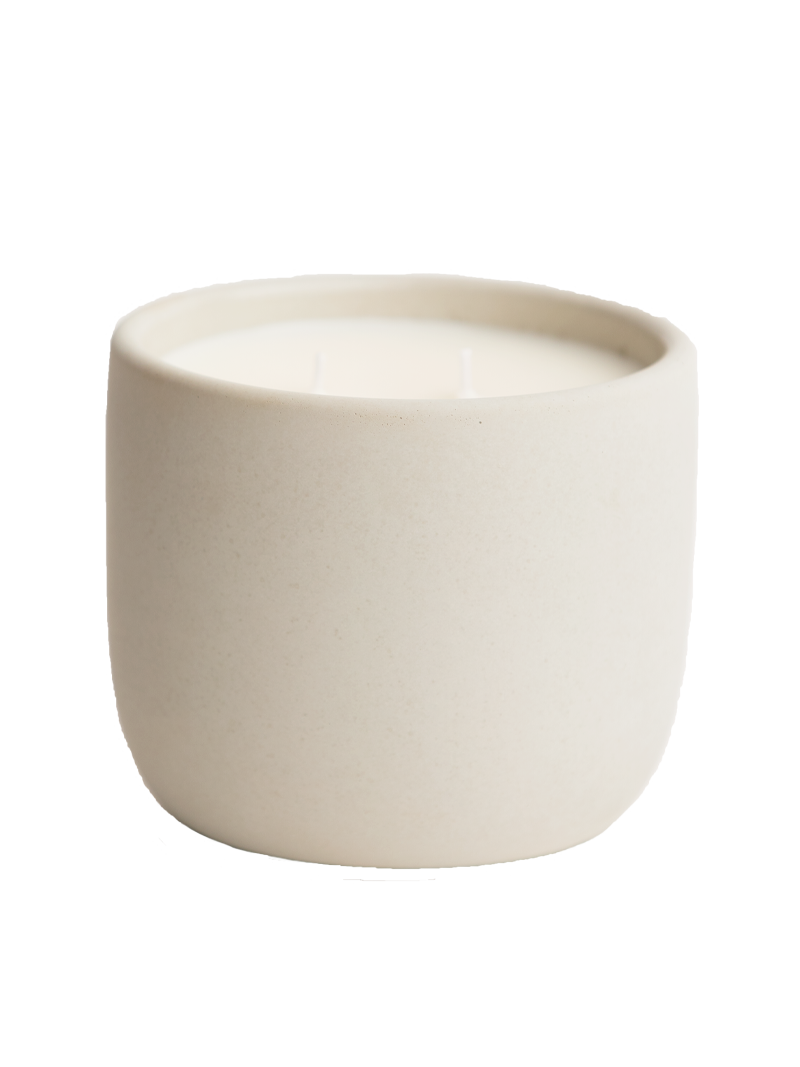 Beige cement candle on a white background