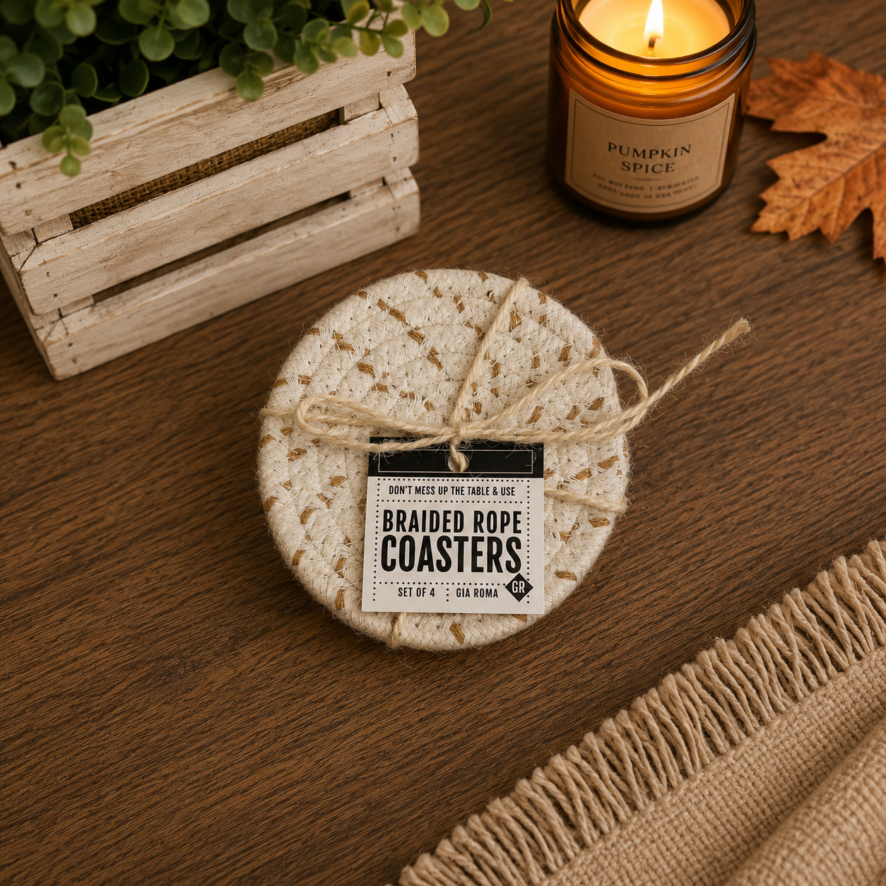 Braided rope coasters on a wooden surface with a candle and decorative elements.