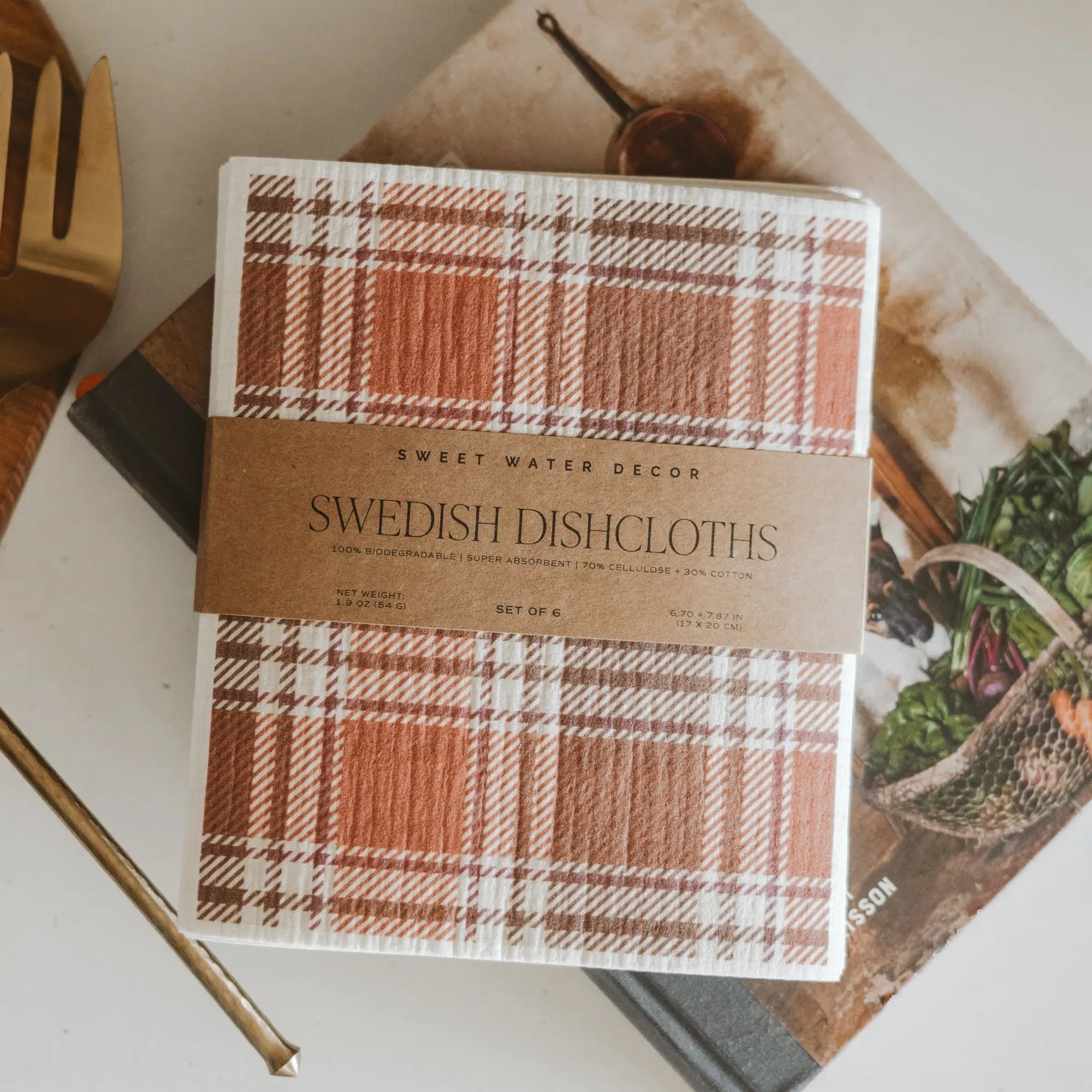 Pack of Sweet Water Decor Swedish Dishcloths with plaid design on a surface.