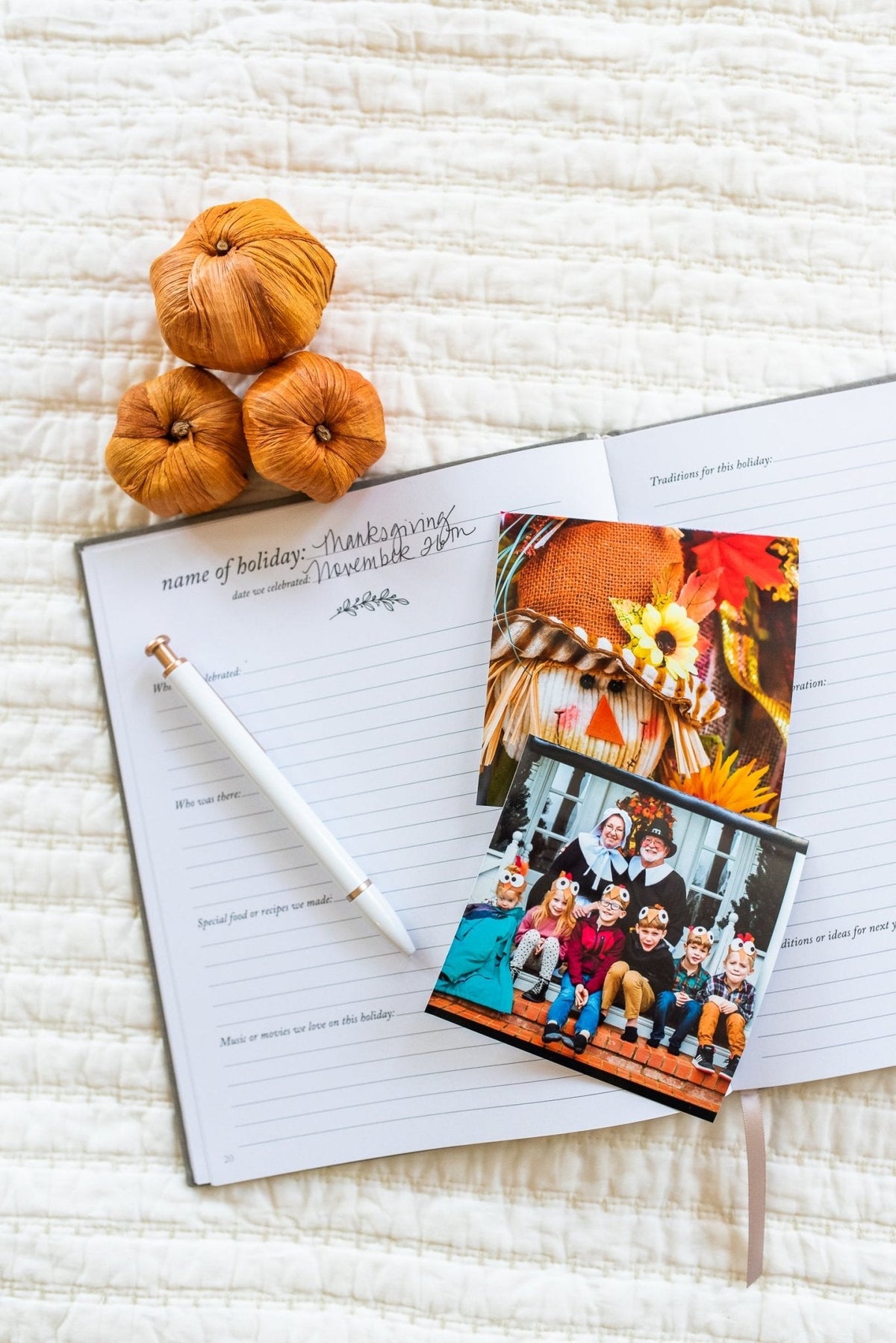 holiday memory book by Duncan & Stone with small pumpkins and fall photos